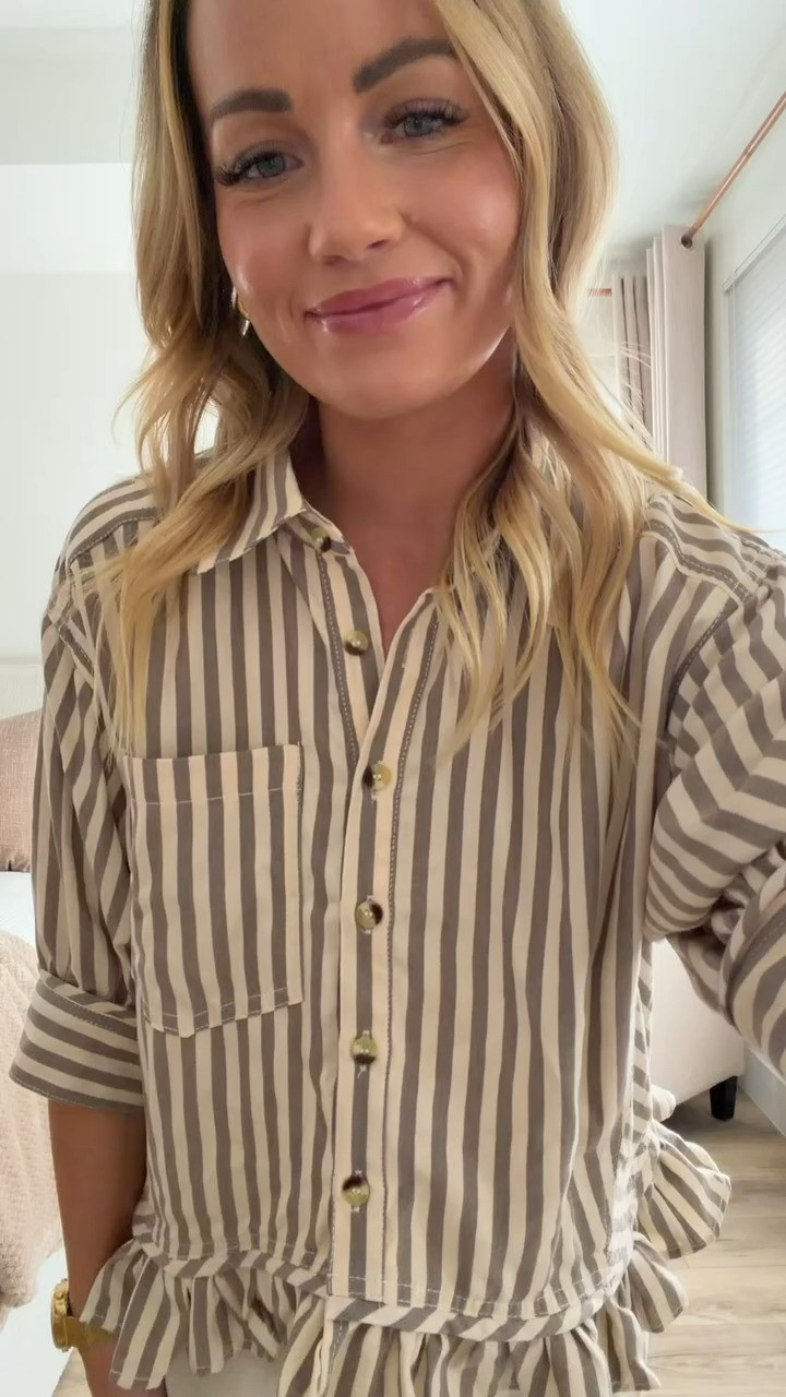 This striped blouse and pants set is perfect for summer! The ruffled short sleeves add such a feminine touch and the button down style is classic. Love how the set looks put together but feels casual and comfortable. Great for work or weekend plans. The striped pattern is timeless and flattering!

#StripedBlouse #PantsSet #ButtonDownShirt #SummerTops #RuffleDetails #LTKStyleTip 

 #LTKootd #LTKmomlife #LTKWorkwear