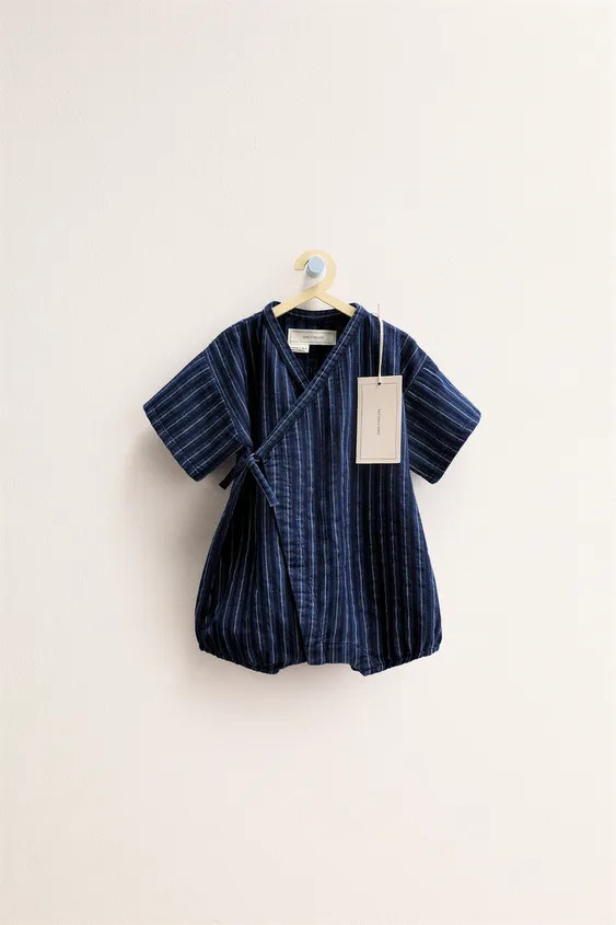 Jumpsuit with a striped print. It has a wrap closure with a tie at the side and elasticized finis... | Zara US
