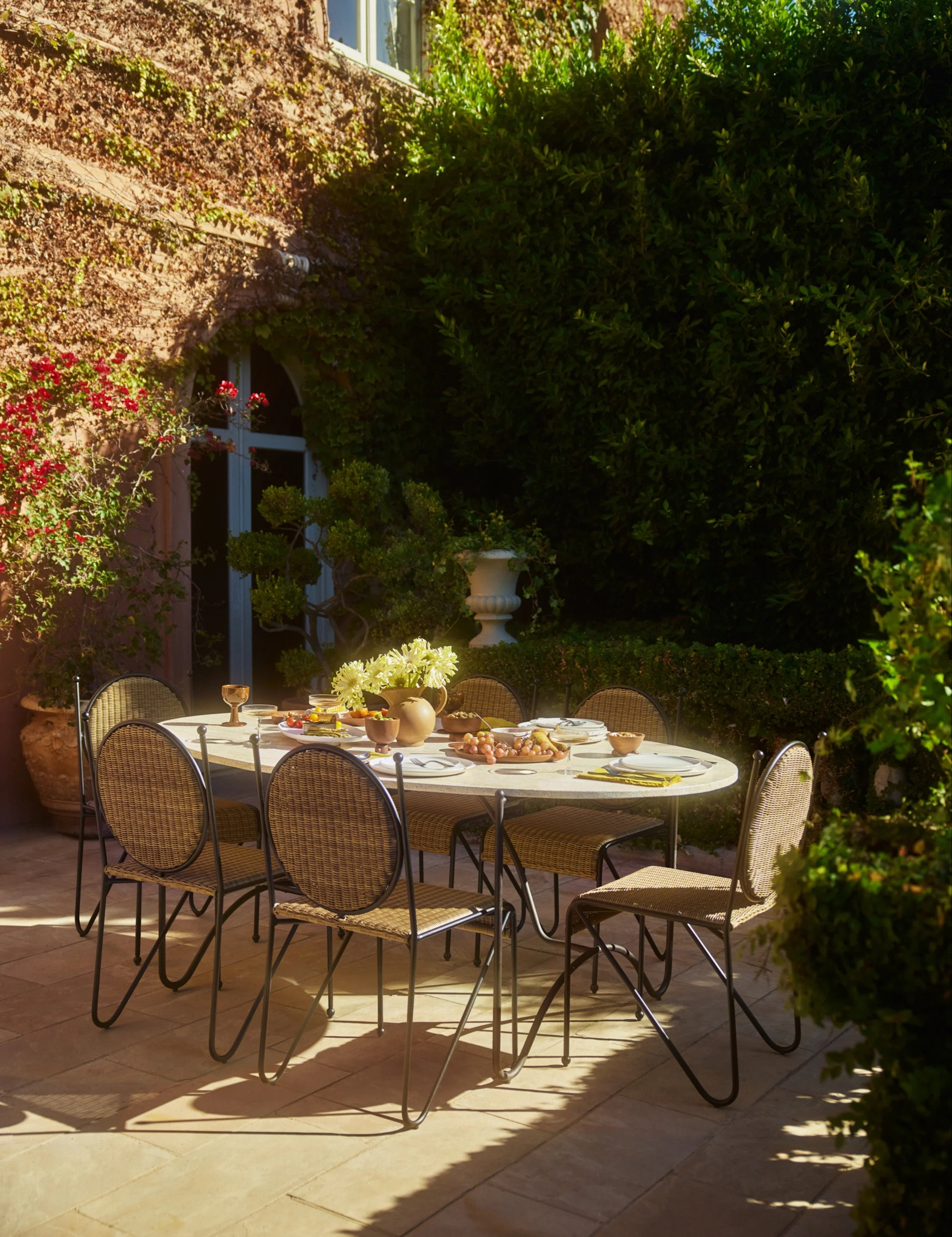 Big fan of alfresco dining in your own backyard? LA designers Sarah Sherman Samuel just dropped her first outdoor collection for Lulu and Georgia. We love Sarah’s relaxed yet refined designs. Among of this new outdoor collection, the Peggy  indoor and outdoor dining table and coffee table are two of our favorites. We love  the oval shape and warm travertine-like tabletop and the squiggly iron bases that are whimsy and playful. The wicker chairs add extra layer of relaxation and comfort. .  #outdoorliving #alfresco 

#LTKSeasonal #LTKhome #LTKparties