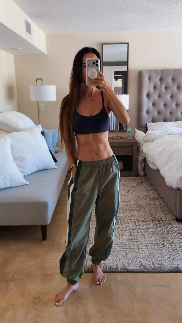 Track pants are having a MAJOR moment and this pair understood the assignment. 💚🔥

The color blocking, the relaxed fit, the sporty little attitude…I’m obsessed. Comfy enough for running around, but cute enough to make the entire outfit feel intentional. Just add a fitted tank, sneakers and a little confidence. 😉

Are we officially bringing track pants into fall? Because I’m already there.

Wearing XS. 

#TrackPants #SportyChic #FallStyle #CasualChic #NicoleColeeStyle

#LTKdayinmylife #LTKgrwm #LTKootd