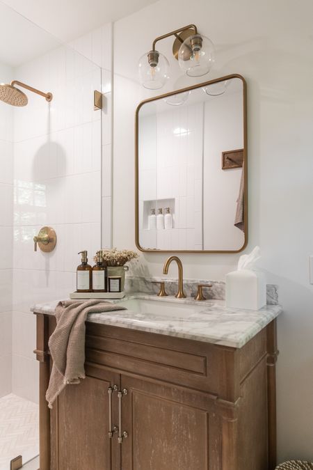 Modern farmhouse neutral bathroom decor; wood vanity and brushed gold fixtures #bathroom #modernfarmhouse #neutralhomedecor 

#LTKunder50 #LTKhome #LTKunder100