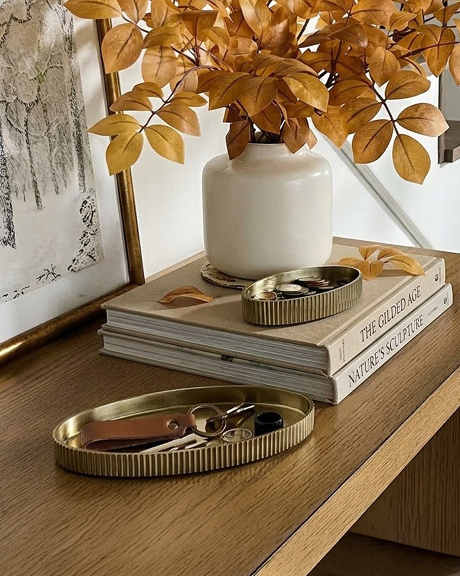 These ribbed brass trinket dishes are the catch-all upgrade your entryway or nightstand didn't know it needed. The fluted texture and warm gold finish give them that quiet-luxury, collected-over-time look, whether they're holding keys and coins by the door or stacked as styling props on a shelf with books and dried stems. Comes as a set of 2 in different sizes, so you can layer them together or split them between rooms. 

 #LTKHome