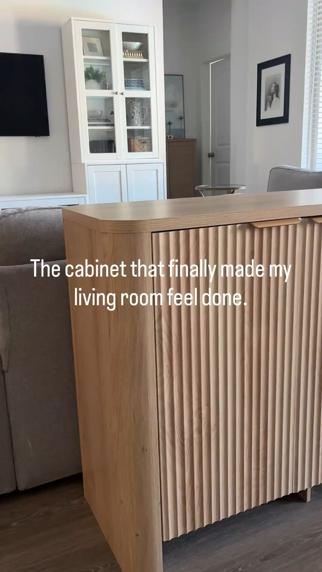 Open storage has been in this spot for the past three years and replacing it with this storage cabinet that hides all the books and toys behind lovely doors is a win. This one piece has settled the space and my mind.