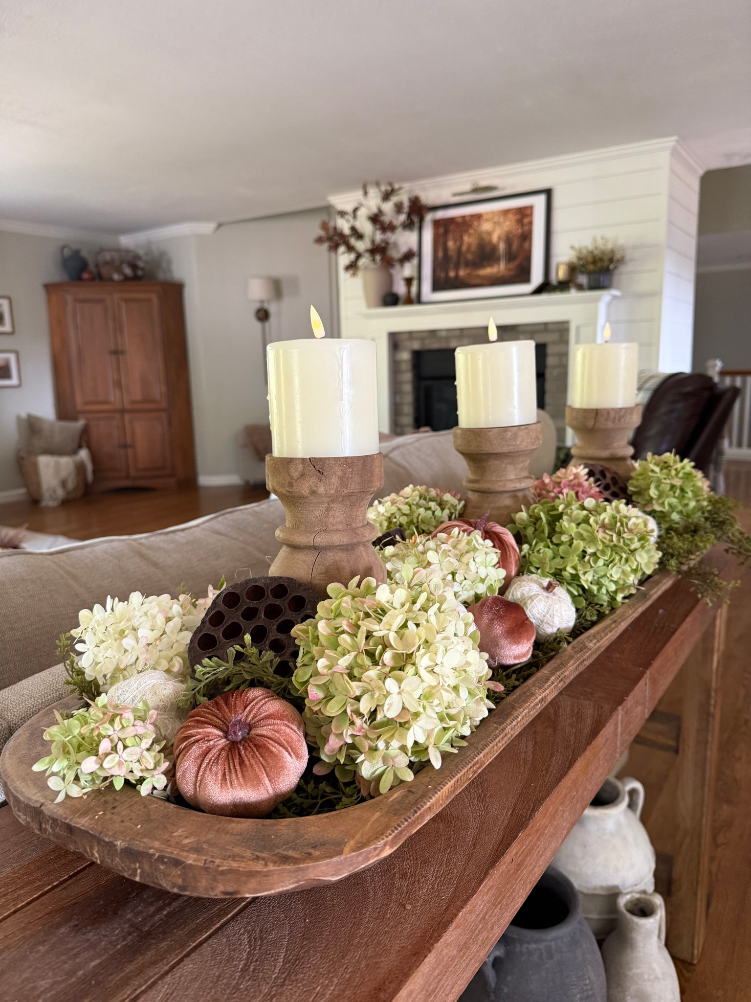 ✨🍂 A Fall Dough Bowl Centerpiece to Steal the Show 🍂✨ This season, nothing feels more timeless than a dough bowl styled with freshly cut hydrangeas, velvet coffee-colored pumpkins, crisp white pumpkins, trailing vine garland, and textured lotus pods. To complete the look, three elegant candleholders sit at the center, casting that soft autumn glow we all love. It’s the perfect blend of natural beauty, cozy textures, and statement style—a centerpiece that makes your home feel both collected and welcoming.


#LTKHome #LTKStyleTip #LTKSeasonal