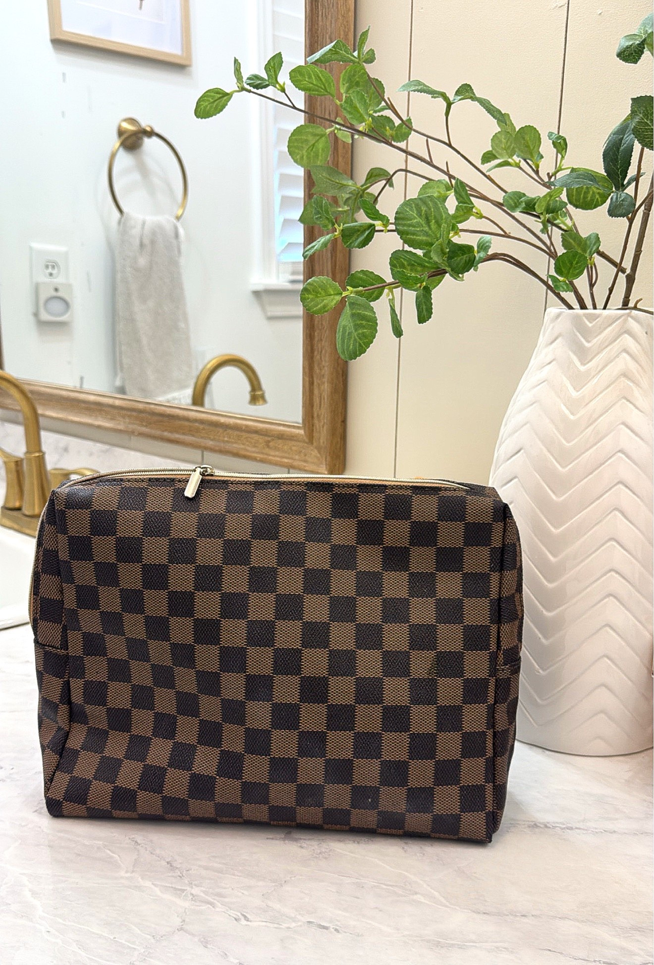 My makeup bag
I love the checker pattern, gold zipper detail and red interior 

It’s a great size that holds a lot! 



#LTKOver40 #LTKFindsUnder50 #LTKBeauty
