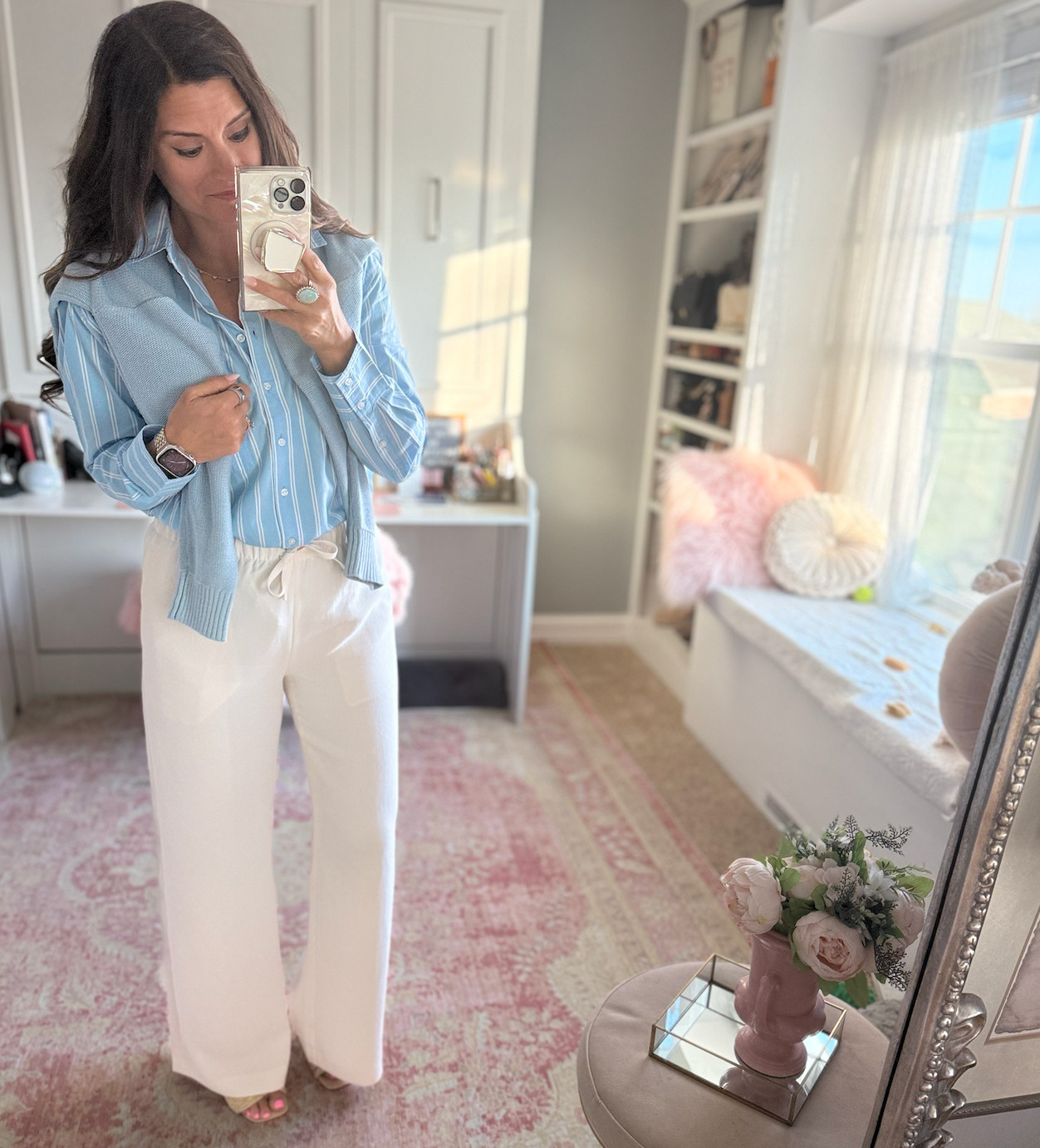 Business casual look with a button down shirt and blue cardigan 

 