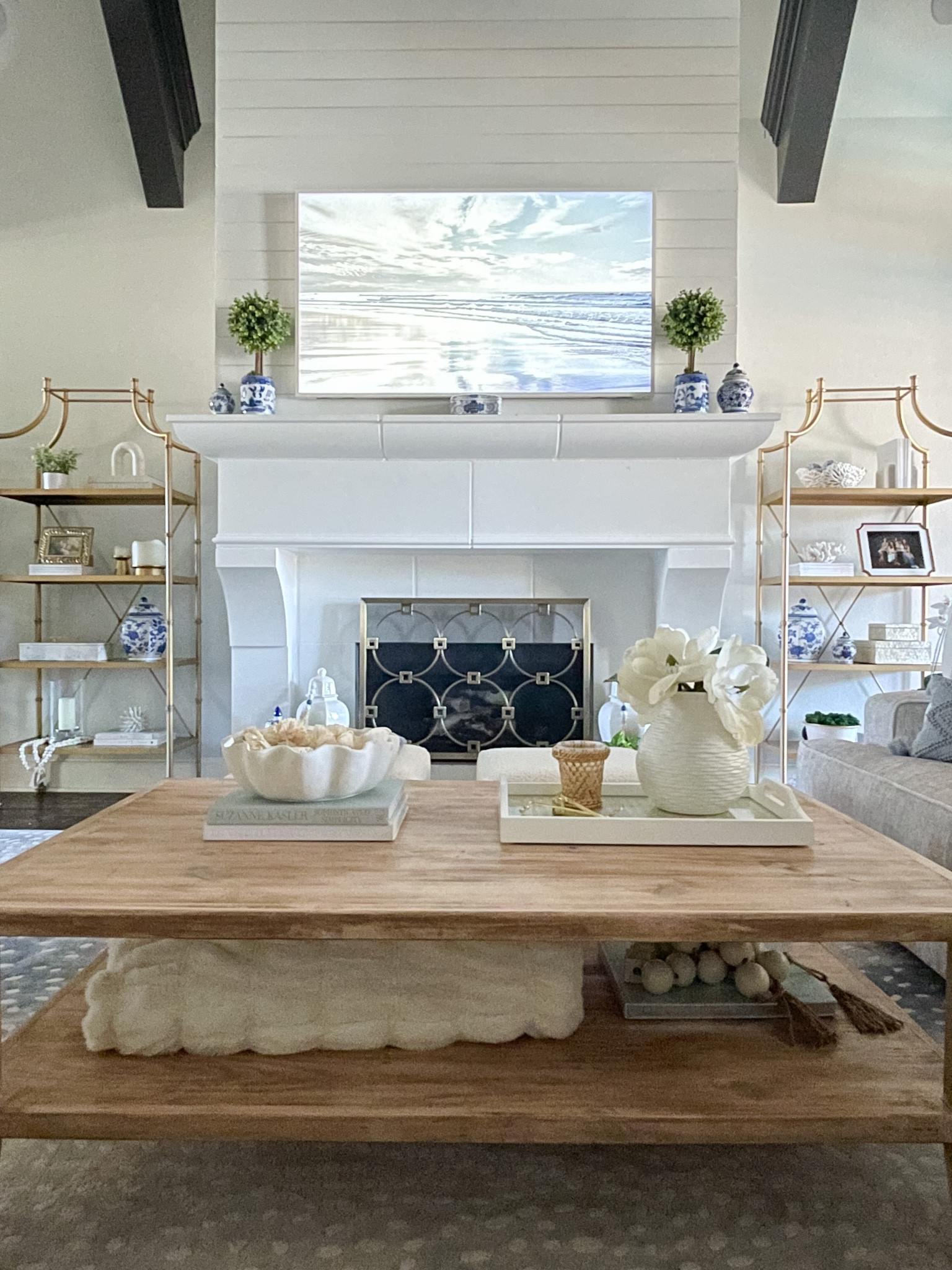 Coastal decor. Coastal Grandmother Home in Dallas. Samsung frame TV. Woods and whites. Chic decor. 

#LTKhome #LTKstyletip #LTKSeasonal