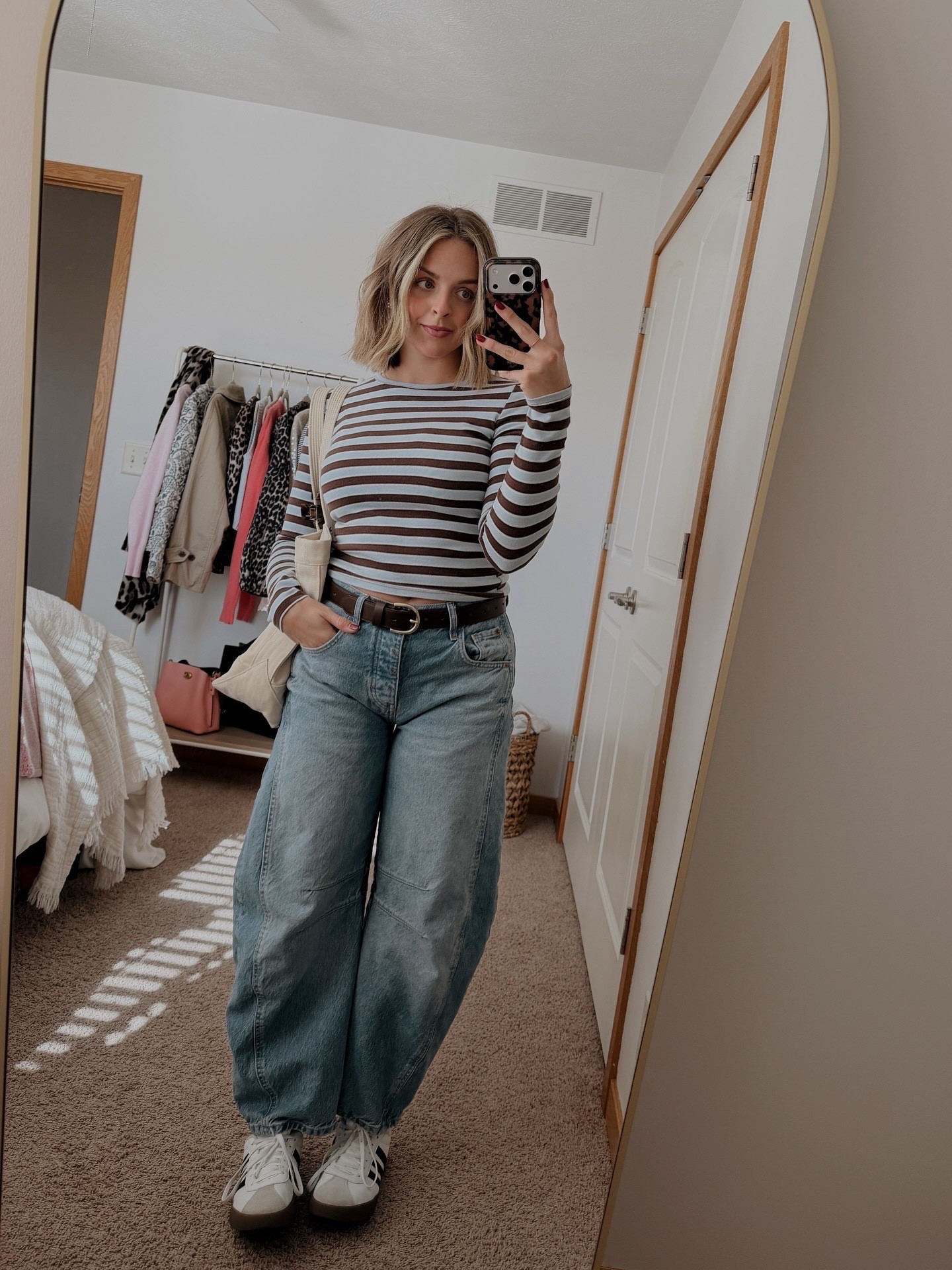 so basic but so cute!! my favorite kind of fit.🤎 Free People Mid-Rise Good Luck Barrel Jean, Target Wild Fable Blue and Brown Striped Top, Brown Target Leather Belt, Adidas Campus Sneakers | #shortgirlstyle #elevatedbasics #cuteandcasual 

#LTKPetite #LTKootd