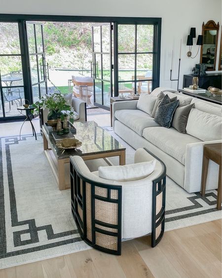 Living room beige geometric border rug and grid back accent chair



#LTKsalealert #LTKstyletip #LTKhome