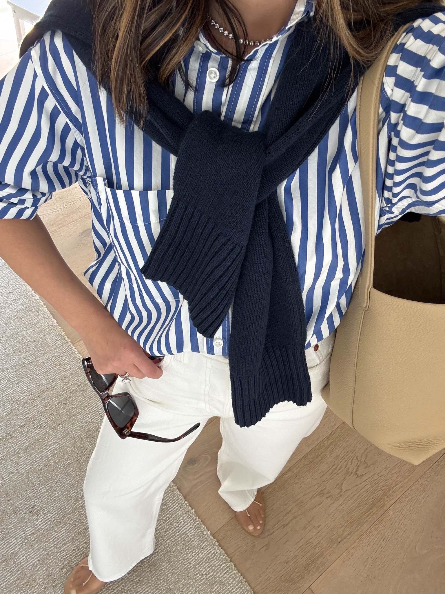 Elevated spring outfit ft. Stripe button down and white jeans. 

Gap Big Shirt petite xs
Levi’s Rib Cage Ankle 25
Everlane cotton sweater xs
Loeffler Randall flats 5
The row. Park tote medium - linked similar 
Celine sunglasses 
Dorsey James necklace 15”
Quince earrings

Spring outfits 2026, spring style, petite style, white jeans

#LTKootd #LTKmomlife #LTKSaleAlert