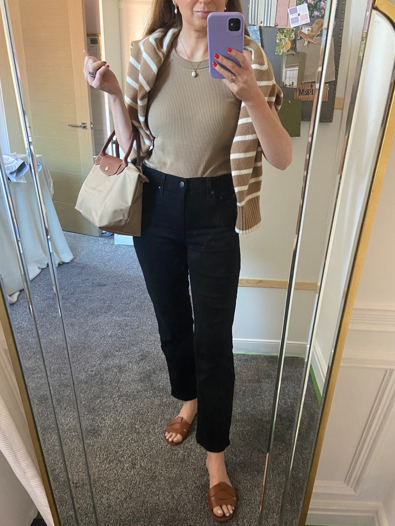 Keeping it classic and cozy in my go-to black Levi’s jeans, layered with my fave Uniqlo tan vest and a striped sweater casually draped for that effortless touch. Finished the look with tan sandals and my staple Longchamp bag — perfect for transitional weather and weekend errands.
Tap to shop the full look 🤎✨

#LTKSeasonal #LTKOver40 #LTKStyleTip