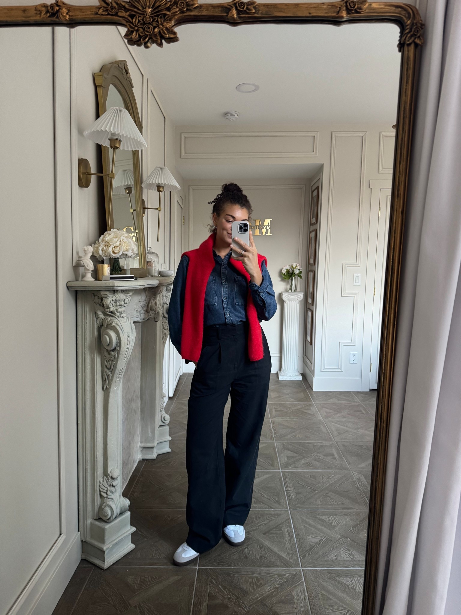 Casual chic outfit: denim shirt, black pants, adidas samba sneakers, red socks, red cardigan draped over shoulders 

#LTKootd