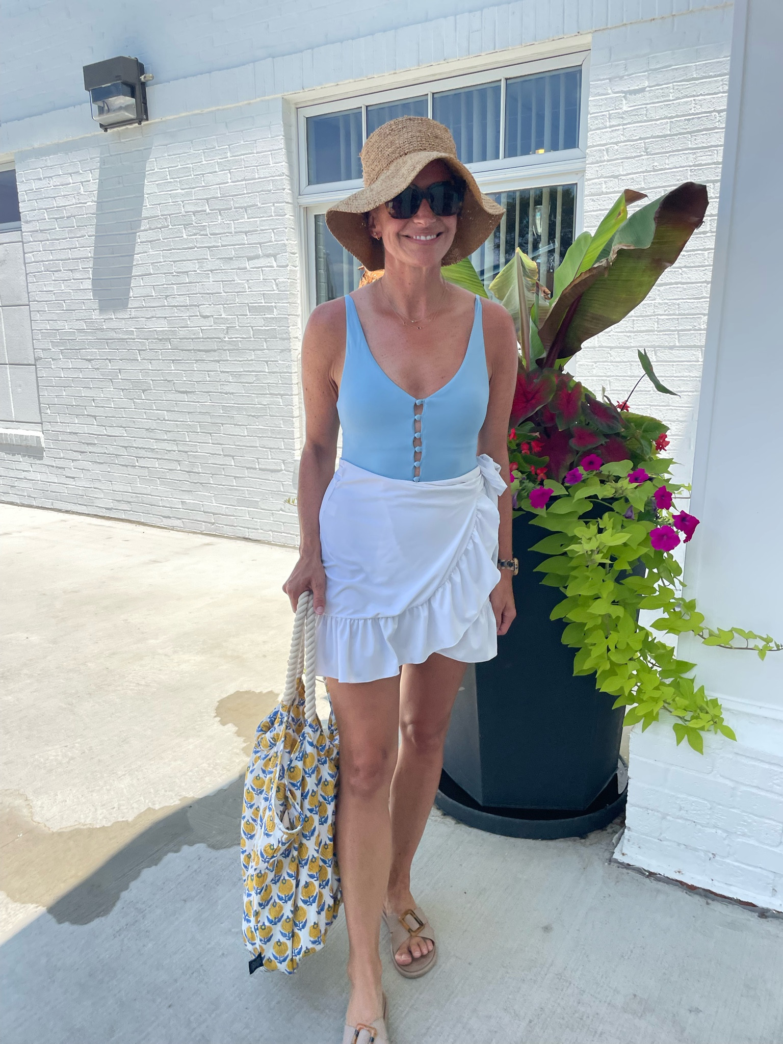 Wrap skirt, swimsuit, and sandals run tts. Code katiev for 15% off Mohala eyewear sunglasses 