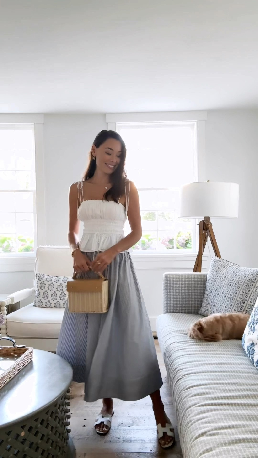 Kat Jamieson wears a white top and stripe skirt in Nantucket. Summer outfit, wicker bag, classic style. 

#LTKFindsUnder50 #LTKSaleAlert #LTKItBag