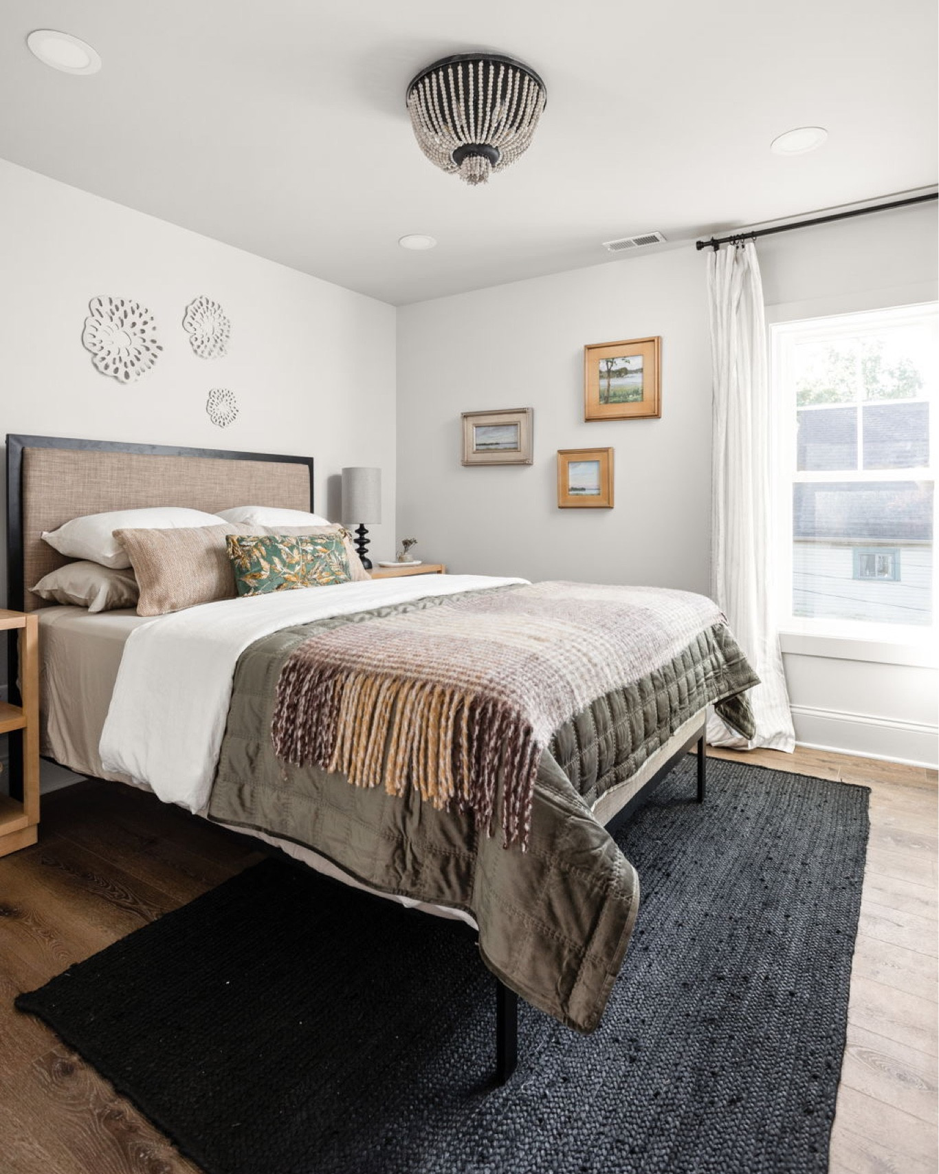 A neutral griege wall color blends perfectly with the moody tones of this bedroom.

#LTKhome