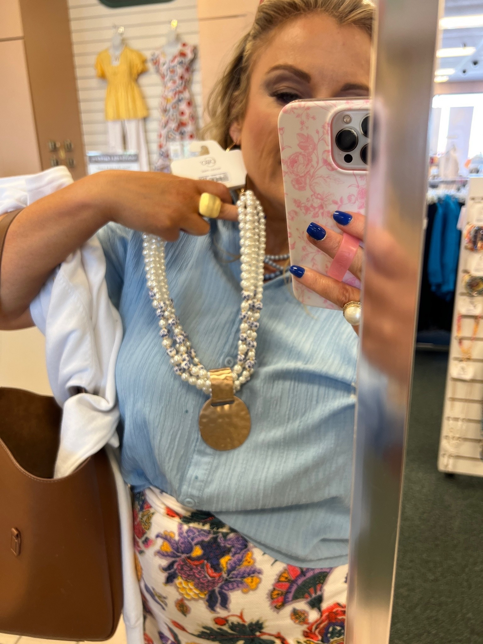 Multistage pearl necklace with blue and white accent beads and large gold medallion under $20

#LTKOver40 #LTKWorkwear #LTKootd