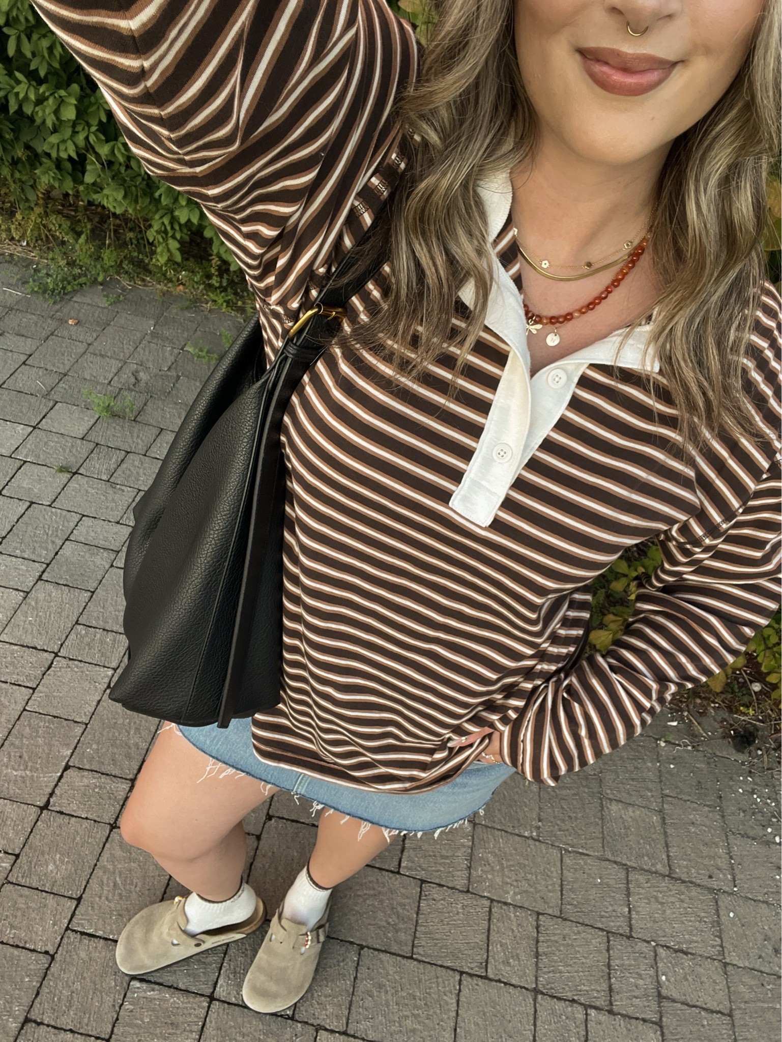 Early fall outfit! Wearing L in the striped rugby polo top, it’s very lightweight so still works for warmer weather! I bought this denim skirt last year in a size 32, would do a 31 if I was purchasing now. I’m a 9.5-10 shoe and wear a 40 in the Birkenstock clogs

#LTKfall #LTKmidsize #LTKstyletip