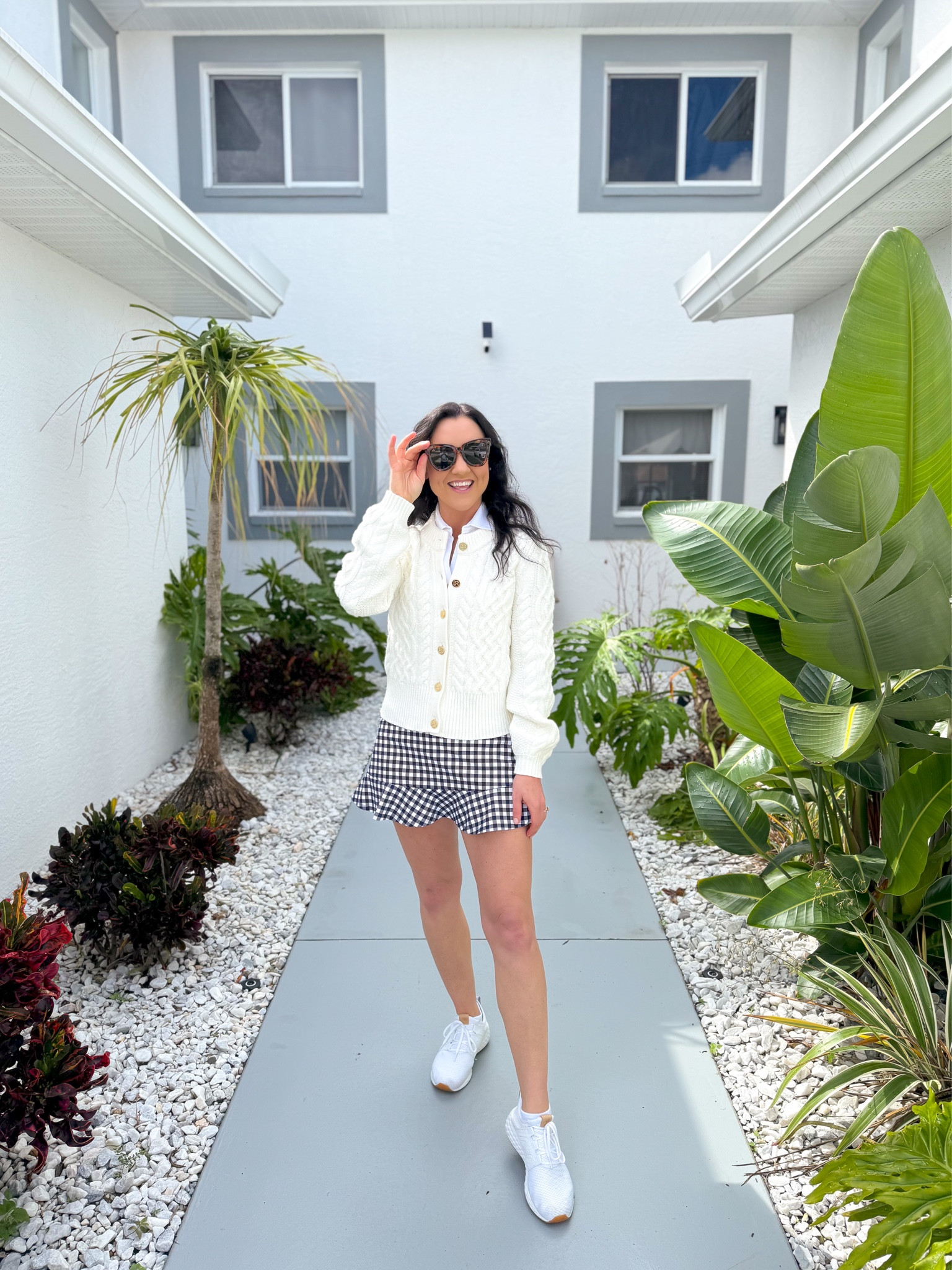 30% off this cute and classic elevated activewear outfit🎉 The quality of these pieces is excellent, and I love that they look just as great paired separately as they do together! 

The ivory cable knit cardigan looks great paired with jeans or white jeans, the white polo is incredibly soft and matches everything, and I love the ruffle detail on the gingham tennis skort🤍

Sizing:
The polo runs a little big in my opinion. I sized down to an XS and it fits perfectly. 
The cardigan sweater also runs a little big, I sized down to an XS. 
The tennis skort fits TTS, I’m wearing a S. 

Activewear outfit, Draper James, sale alert, athleisure wear, casual style, mom outfit, affordable, casual outfit, preppy 

#LTKSeasonal #LTKsalealert #LTKfindsunder100