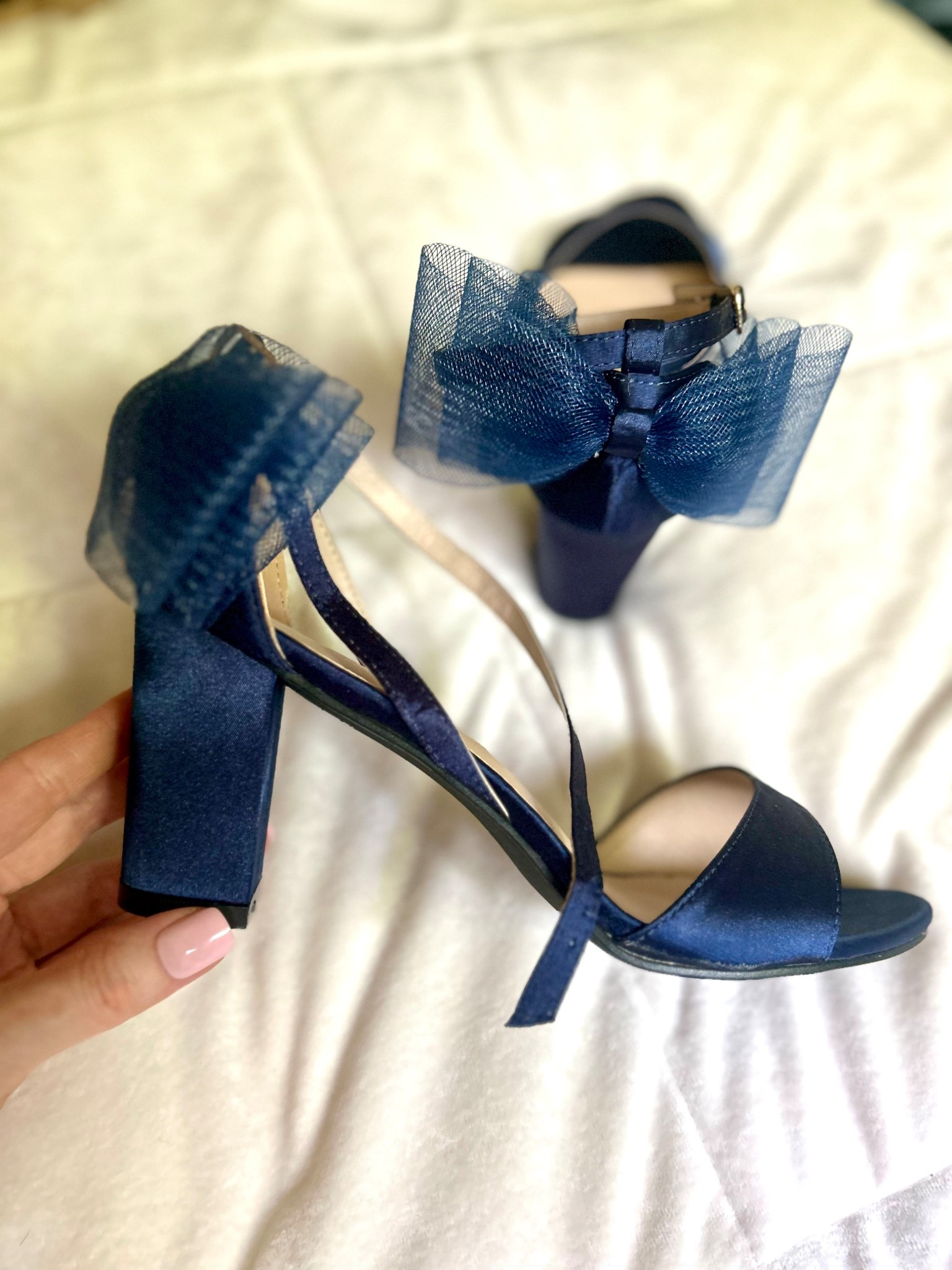 These navy heels are absolutely stunning and the bow serials it too tier !! 

#LTKShoeCrush #LTKWedding #LTKParties