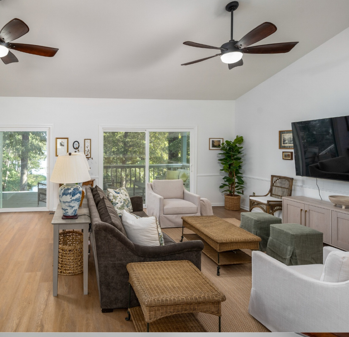 Living room at the lake. Target swivels, customizable slip covered ottomans, customizable raw wooden console table, chinoiserie lamps. Sofa is gabby Westley sofa (not linked) in savvy caviar fabric. Thanks for shopping! 

#LTKStyleTip #LTKHome