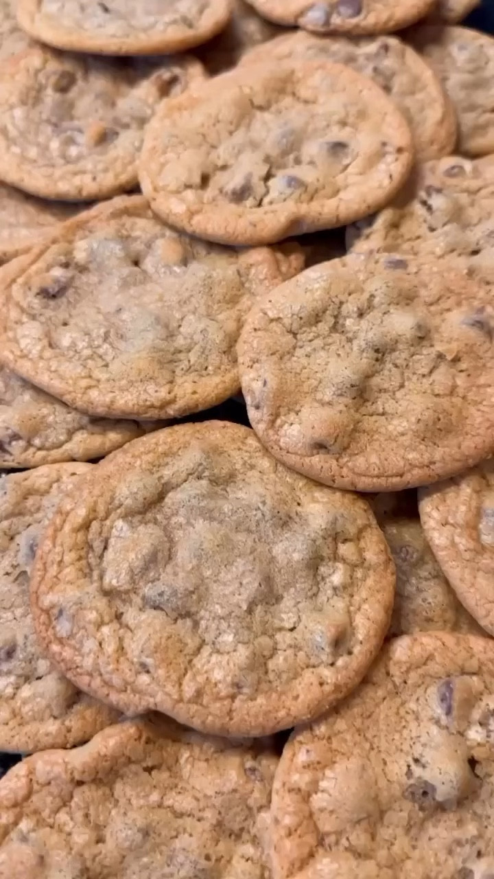 Chocolate Chip Cookies

Chewy, flat and delicious cookies is what I’m all about. The recipe isn’t a secret, what is is how you make them! 
It’s the toll house recipe but the trick is to cream the butter and sugar really well, as in for 5 minutes. 
Also, you NEED the air bake pans.

INGREDIENTS
2 1/4 cups all-purpose flour
1 teaspoon baking soda
1 teaspoon salt
1 cup (2 sticks) salted butter, softened
3/4 cup granulated sugar
3/4 cup packed brown sugar
1 teaspoon vanilla extract
2 large eggs
2 cups Nestle Toll House Semi-Sweet Chocolate Morsels (12 ounce package)

Preheat the oven to 375°.
In a medium bowl add the flour, baking soda, and salt. Combine and set aside.
In a mixer add the butter, sugar, and brown sugar. Beat together until light and fluffy, about 5 minutes.
Add the eggs, one at a time.
Add the vanilla and combine.
Gradually mix in the flour mixture.
Stir in the chocolate chips.
Use a cookie dough scooper and add onto an air bake cooking sheet, leaving 2 inches between each cookie. (I’ve linked my favorite cookie sheet)
Bake for 9 to 11 minute or until just golden brown. Allow the cookies to cool on the sheet for 2 minutes after baking. Remove to wire racks to cool completely.

#LTKVideo