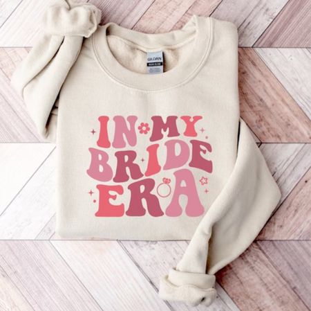 Bride Era Sweatshirt

Engagement Gift | Retro font | Bride Shirt | Wedding Gift T-Shirt | Gift For Bride | custom Shirt | Eras sweatshirt | Taylor Swift | Bachelorette party 

#LTKSeasonal #LTKwedding #LTKstyletip