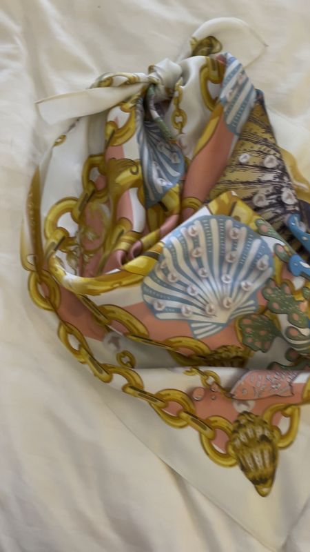 Showing the true colors of this beautiful seashell print scarf - it looks yellow online but it’s ivory in person! 
.
Kurt Geiger Seashell Scarf

#LTKfindsunder100 #LTKstyletip #LTKSeasonal