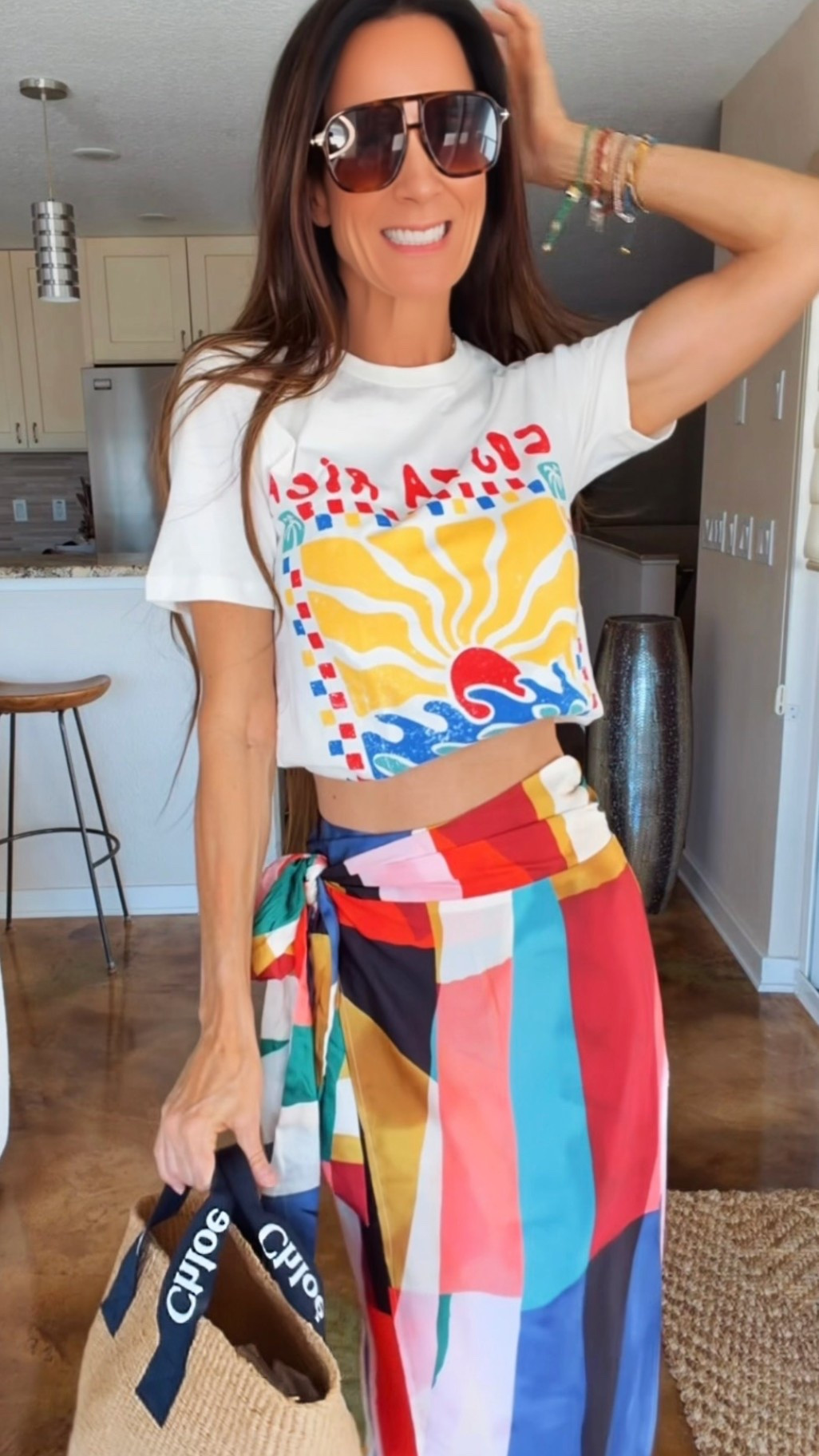 Color therapy but make it fashion 🌈✨
This silky wrap skirt + casual tee combo is giving “vacation energy with zero effort” and honestly… I’m obsessed. The bold colors, the flowy fit, the easy vibe — this is the kind of outfit that instantly puts me in a good mood 💃☀️

Proof that a simple tee and a statement skirt can absolutely steal the show. Paired it with oversized sunnies and a straw tote for the ultimate chic-but-fun summer look 🤍

And use code NICOLECOLEE35 for 35% off your order!

#ColorfulStyle #VacationStyle #SummerOOTD #ChicCasualStyle #NicoleColeeStyle

#LTKdayinmylife #LTKgrwm #LTKootd