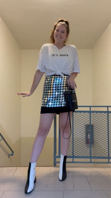 Nasty gal Layered Disc Chainmail Mini Skirt, on sale, budget friendly, affordable, harry styles concert outfit, let’s disco graphic tshirt, graphic tee, two tone boots, black and white booties, gold jewelry from Amazon, rings, hoop earrings, balenciaga crossbody bag, black purse 

#LTKsalealert #LTKunder50 #LTKunder100