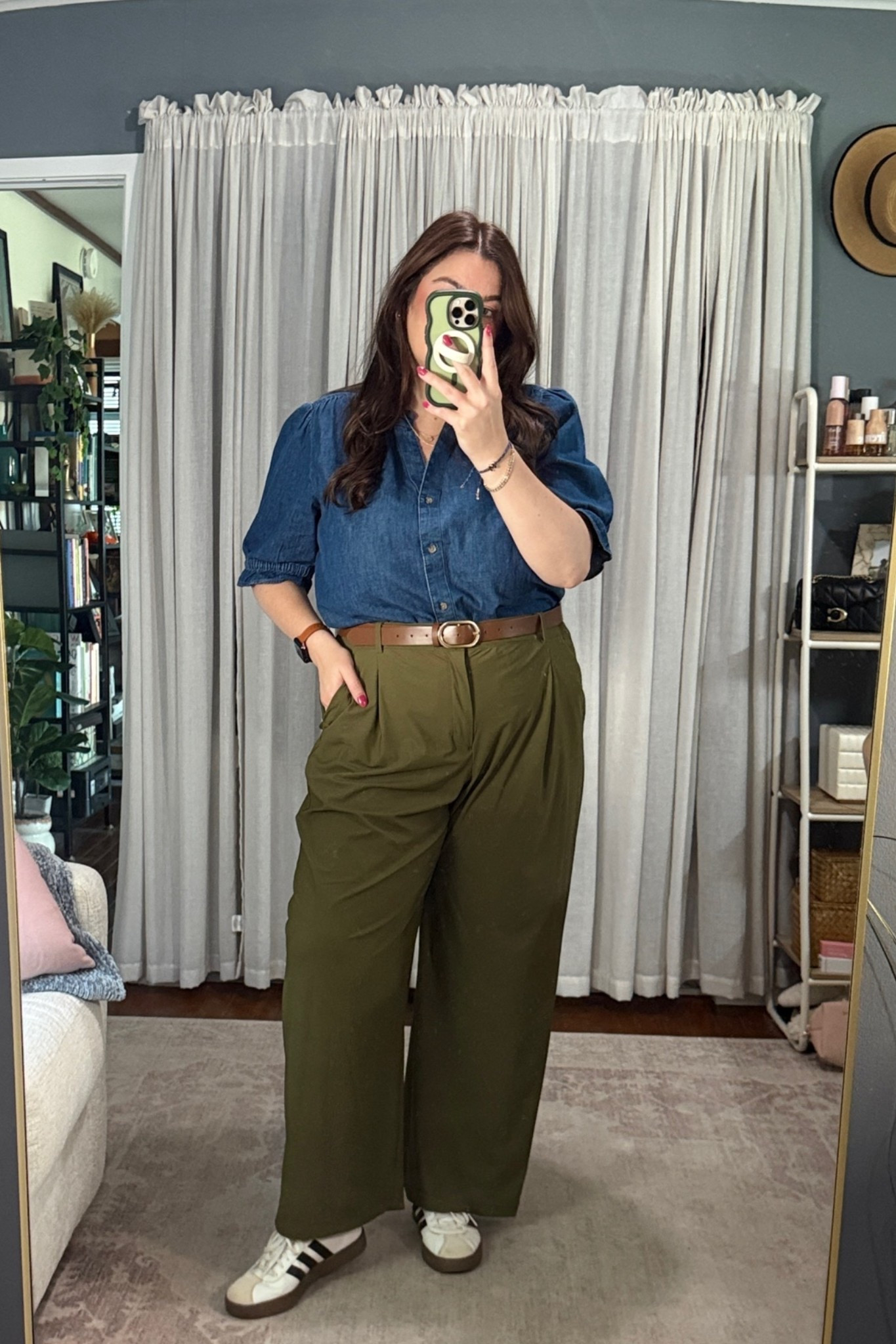 Monday’s WFH outfit, in real life. 🤎

I’m officially making the case for dark olive trousers as a neutral. The Hearthwood color of these Old Navy SleekTech trousers works with so much in my closet, but feels a little more interesting than reaching for black again.

Today I paired them with the puff-sleeve chambray top from Sonoma at Kohl’s. I love that the sleeves give a classic chambray shirt a little something extra while still keeping the entire outfit easy enough for a day at home.

Simple pearl studs, my everyday tennis bracelet, Apple Watch, and adidas sneakers finished it off.

Midsize WFH outfit verdict: comfortable enough for my desk, but absolutely pulled together enough to leave the house without changing.

You can find today’s outfit details on my LTK — Rebecksley.

Save this one if you need a little inspiration for styling olive trousers.

#LTKootd #LTKMidsize #LTKWorkwear