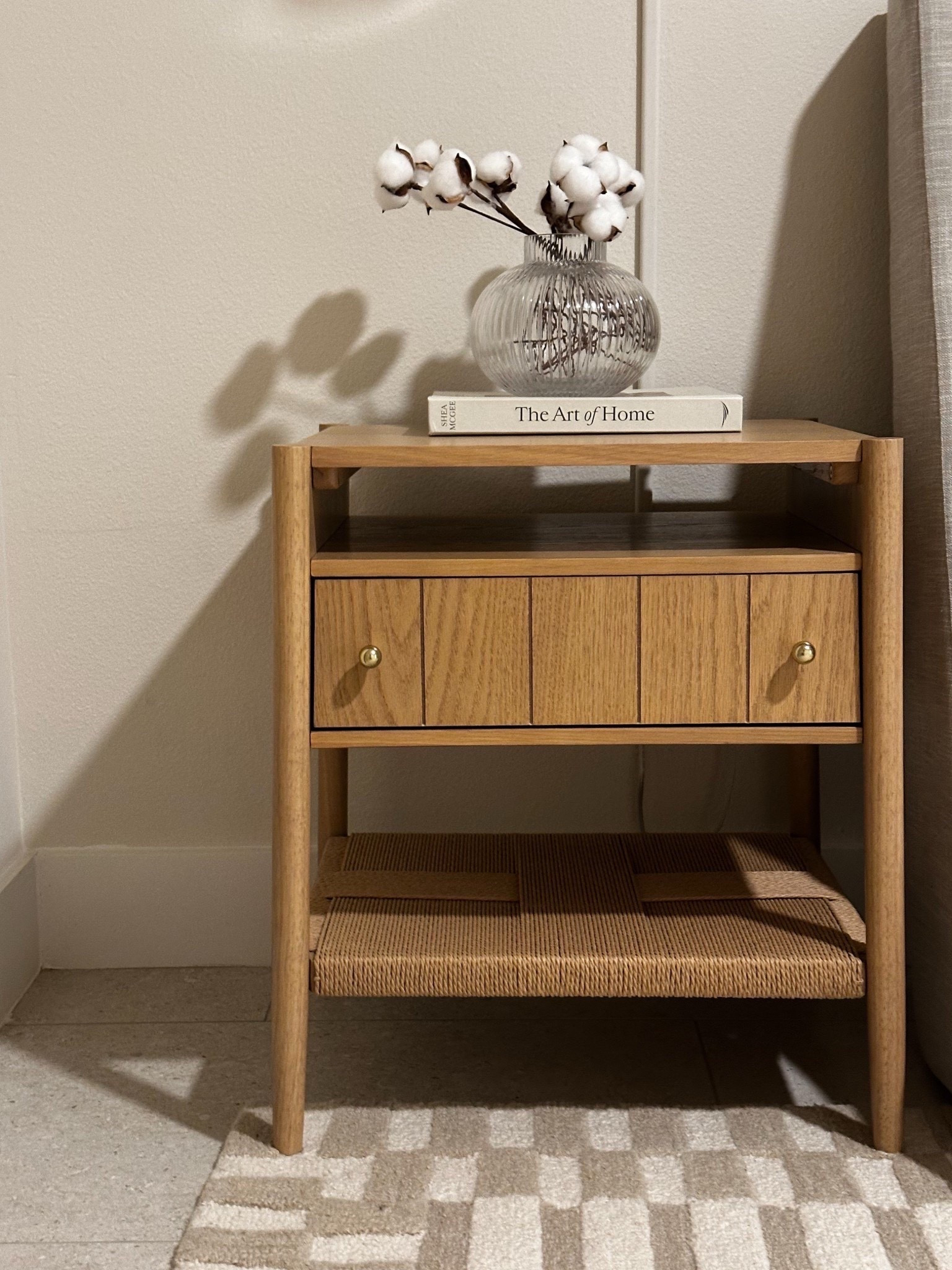 Warm wood textures, woven details, and a touch of cotton-stem décor create the perfect neutral nightstand styling. Subtle, modern, and timeless—perfect inspiration for a cozy, minimalist bedroom.

#LTKHome