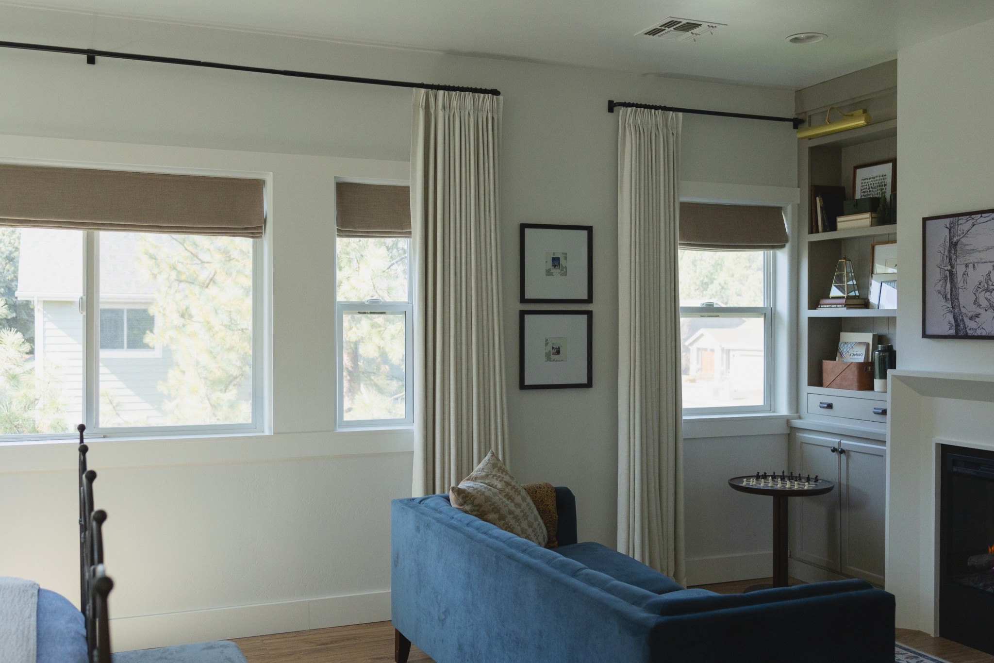 Window treatments are often an overlooked design element, but look at the impact they make! I have custom linen curtain panels paired with custom linen roman shades in a contrasting color here and they make the room feel curated and complete.

#LTKHome