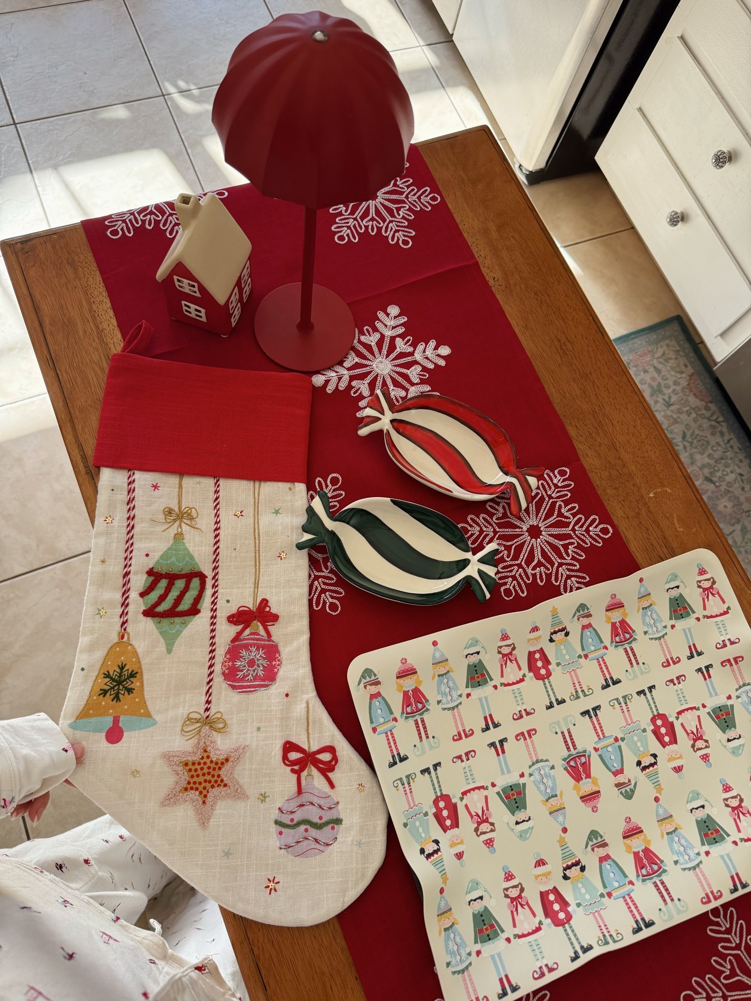 setting up to host a Christmas cookie decorating party
 @wayfair #ad #wayfair #WinTheSeason #WayfairPartner
Peppermint candy trays, silicone baking sheet, cute stocking, Christmas decorations from wayfair 