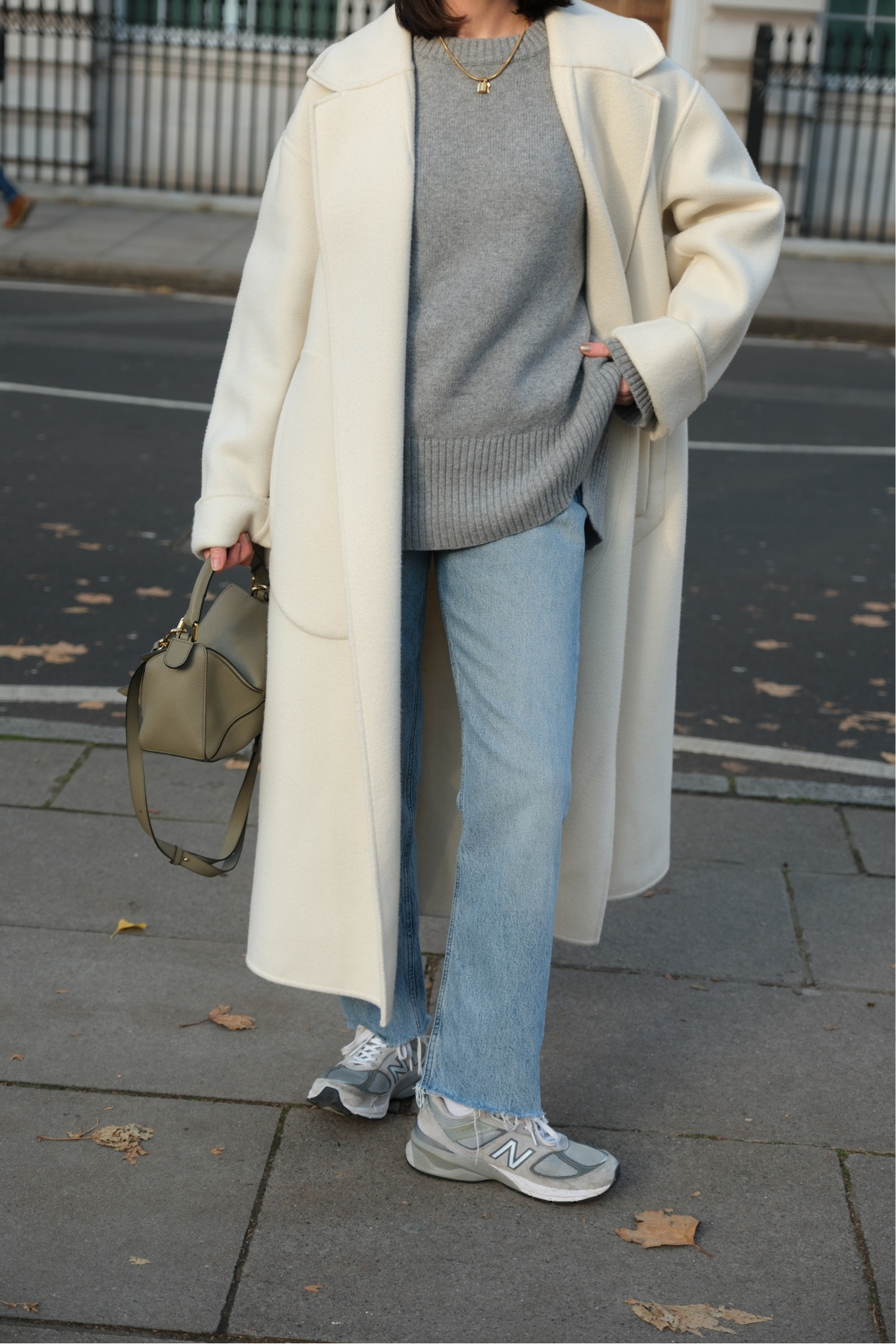 Long coat, straight light blue jeans, grey new balance trainers, grey leather handbag crossbody, knit jumper 

#LTKstyletip #LTKSeasonal #LTKeurope