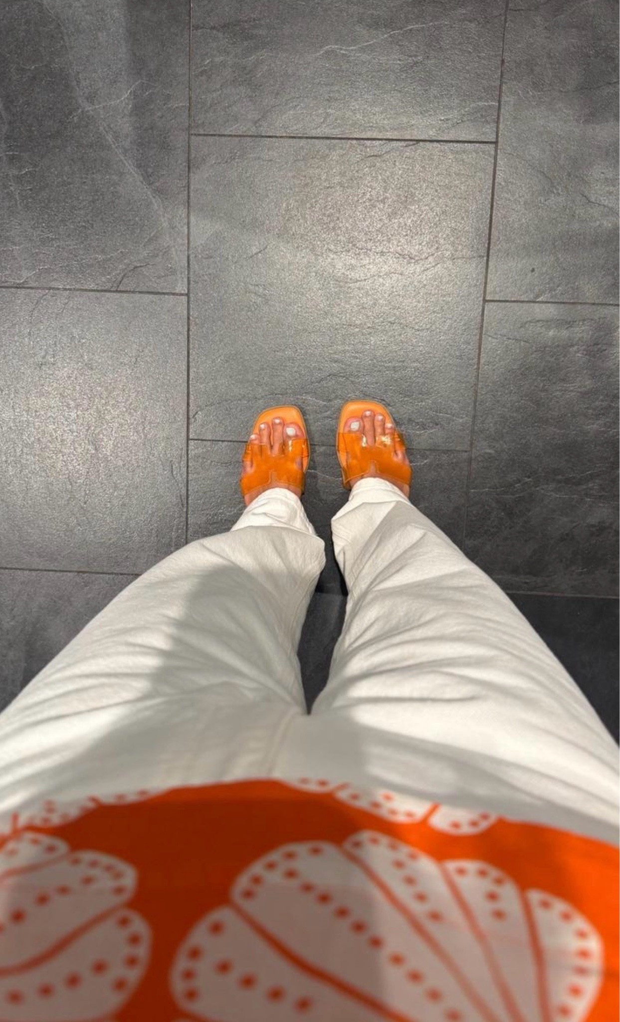 A simple outfit with a fun pop of color. These orange jelly sandals pair perfectly with crisp white pants for an effortless look that feels fresh and playful. 🍊

#OrangeSandals #SummerStyle #CasualChic #WhitePants #EverydayOutfit #ColorPop #EffortlessStyle #VacationStyle #FashionFinds #OutfitInspiration
