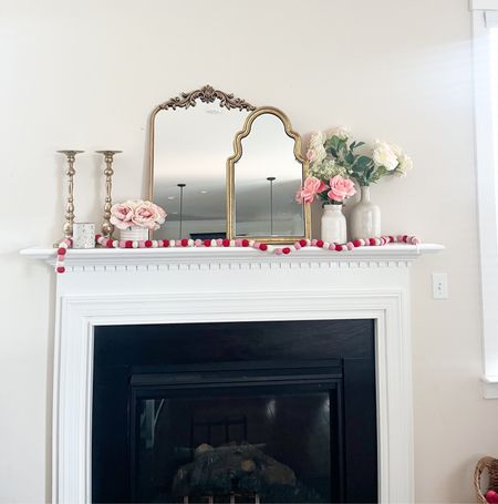 Love my mantle mirrors, candle stands & flower decor. 

#LTKhome