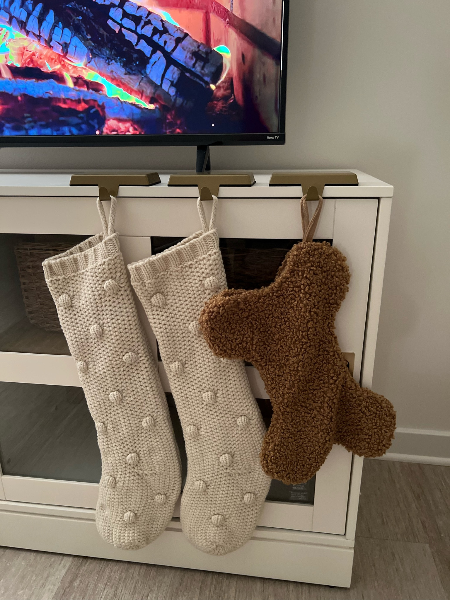 Here’s my cute little stocking set up that I have on my TV stand! Since I’m in an apartment and don’t have a fireplace or a mantle , I think this is the perfect little cozy nook to hang my stockings! I linked all of the exact products I have in this photo along with some similar! Happy Holidays 💌🎄✨ 

#LTKhome #LTKSeasonal #LTKHoliday