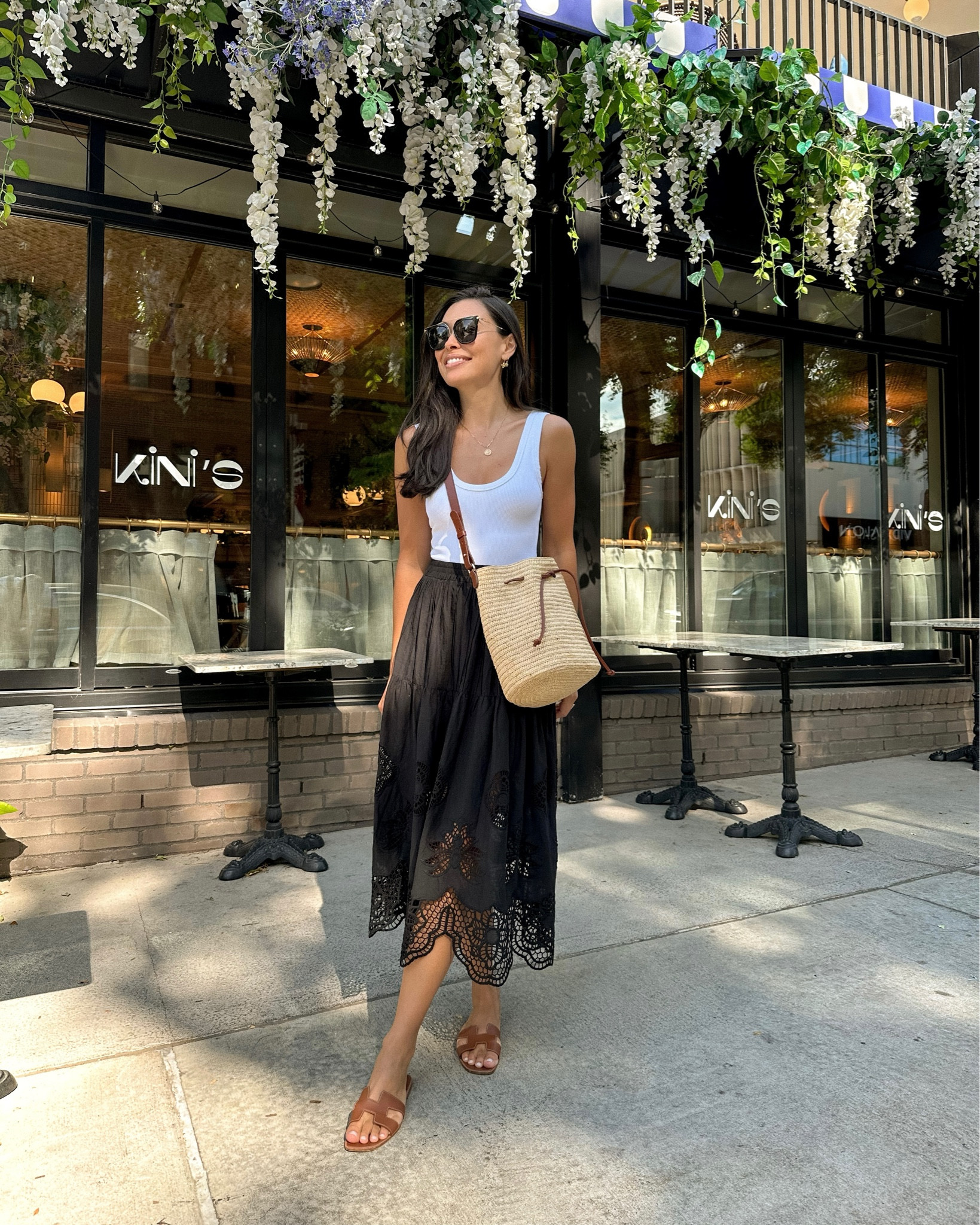 Kat Jamieson wears a black eyelet midi skirt, bodysuit and crossbody bag. 

#LTKSeasonal #LTKitbag #LTKshoecrush