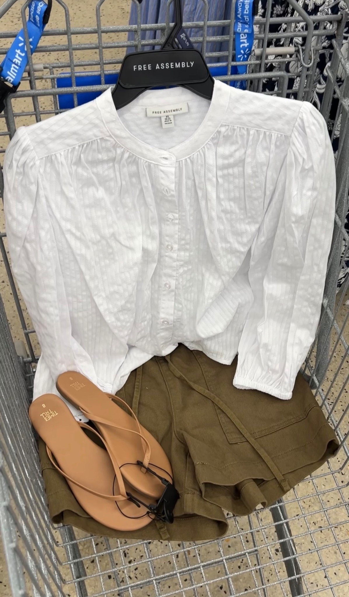 Walmart spring outfit idea with this long sleeve cotton blouse and paperbag waist pull on shorts in olive green. I went with a small in the top and sized up one size to a medium in the shorts (they run small
IMO). #walmartfashion 

#LTKOver40 #LTKootd