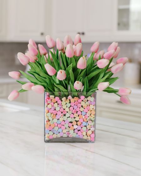 Valentines Floral Arrangement using faux flowers from amazon! 

These faux tulips look and feel real. I’m using a total of 40 tulips here , two cube vases from Michael’s, and sweetheart candies from Walmart 💗 

#LTKSeasonal #LTKunder50 #LTKhome