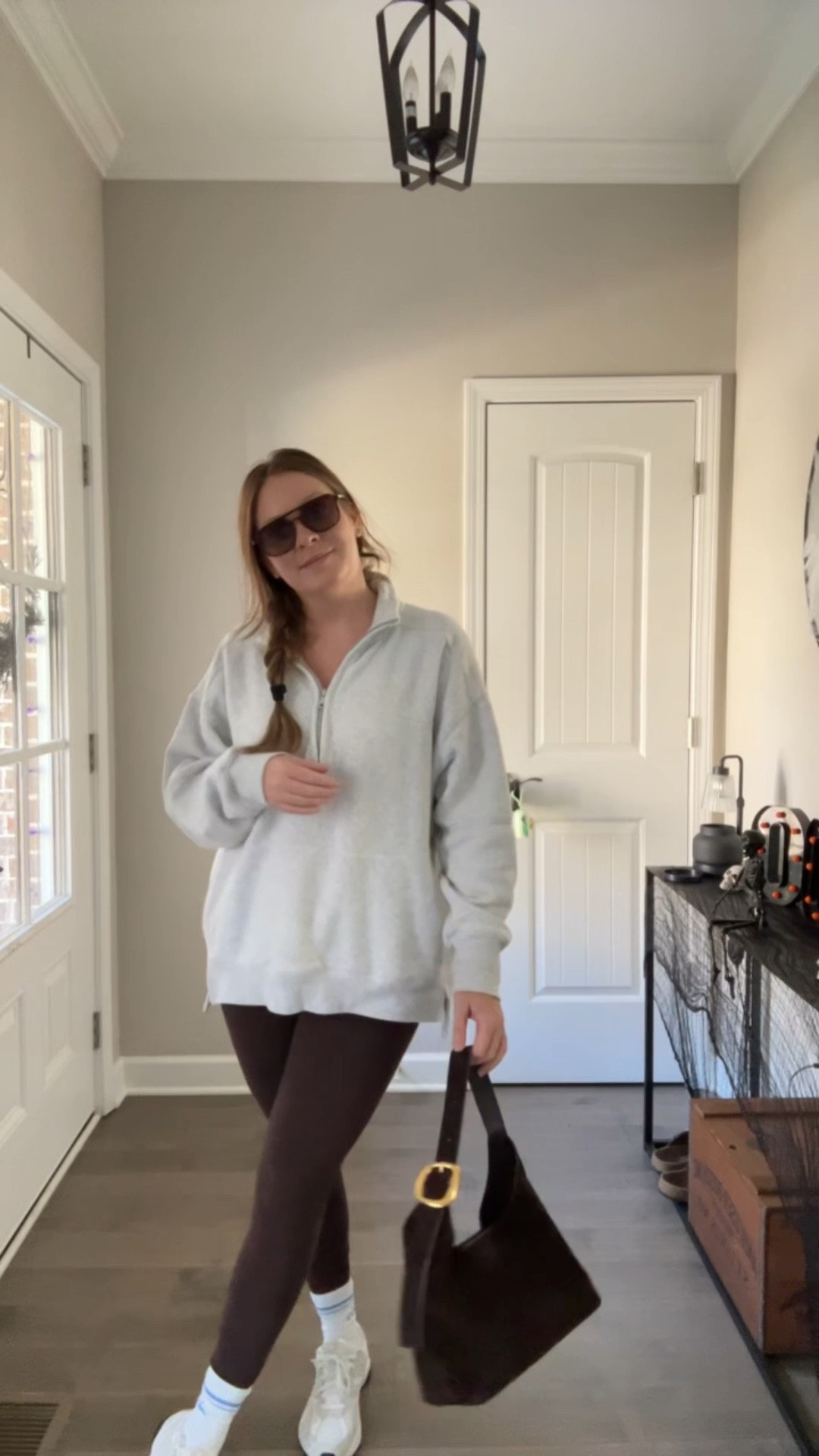 Grey half zip sweatshirt / oversized tts / wearing a medium 
Brown butter soft leggings / tts wearing a medium 
Crew sock 
Sneakers 
Brown suede bag 
Sunglasses 

#LTKActive #LTKFindsUnder50 #LTKSaleAlert