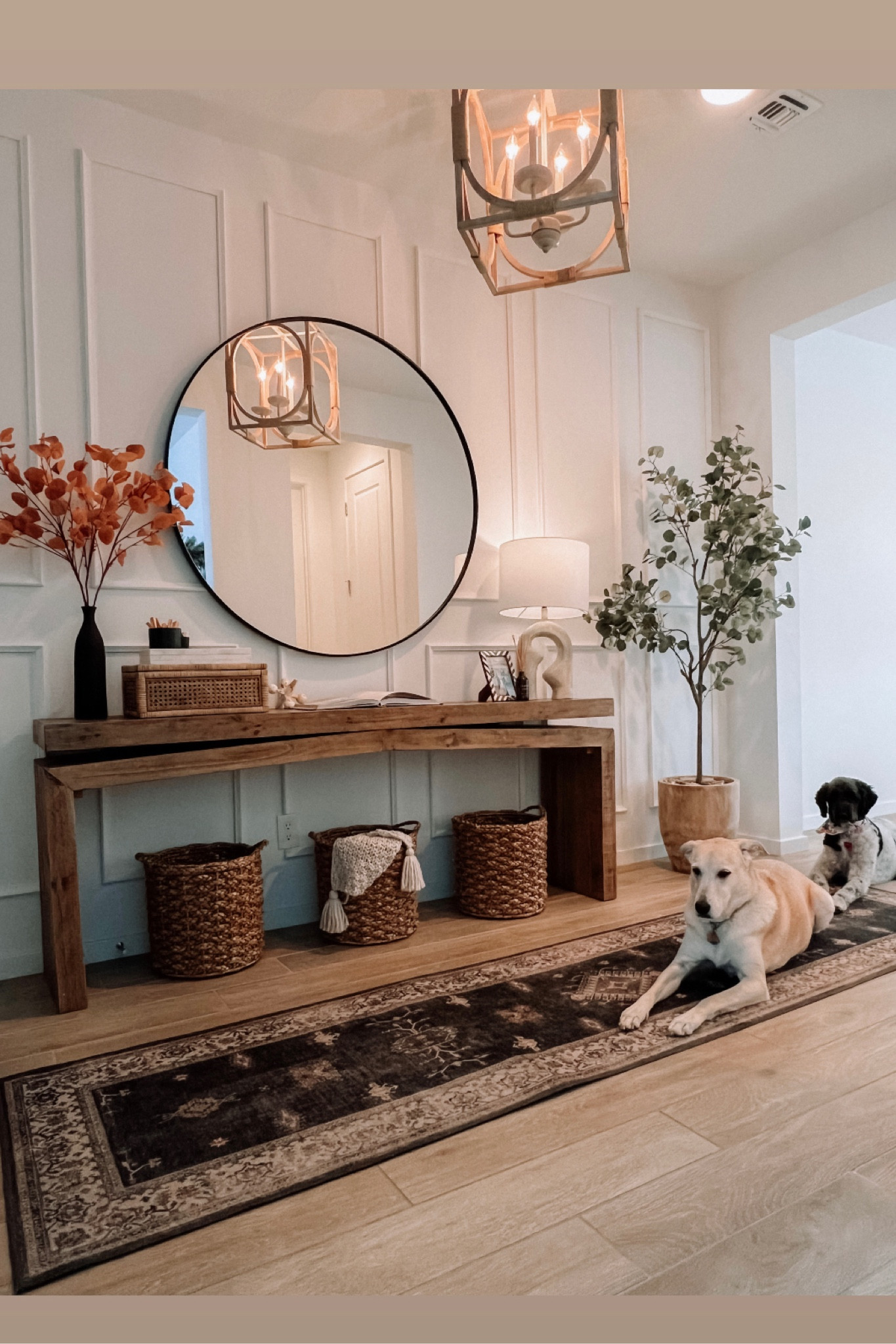 This is my home entryway. Wall moulding are a DIY Etsy find, easy to install!! Round mirror is 48”, rug is 10% off with code ALWAYSMELISS10 , baskets are a target find, faux tree is Amazon, decor pieces are mostly Amazon too , chandelier is wood and beautiful!!

#LTKstyletip #LTKhome #LTKunder100