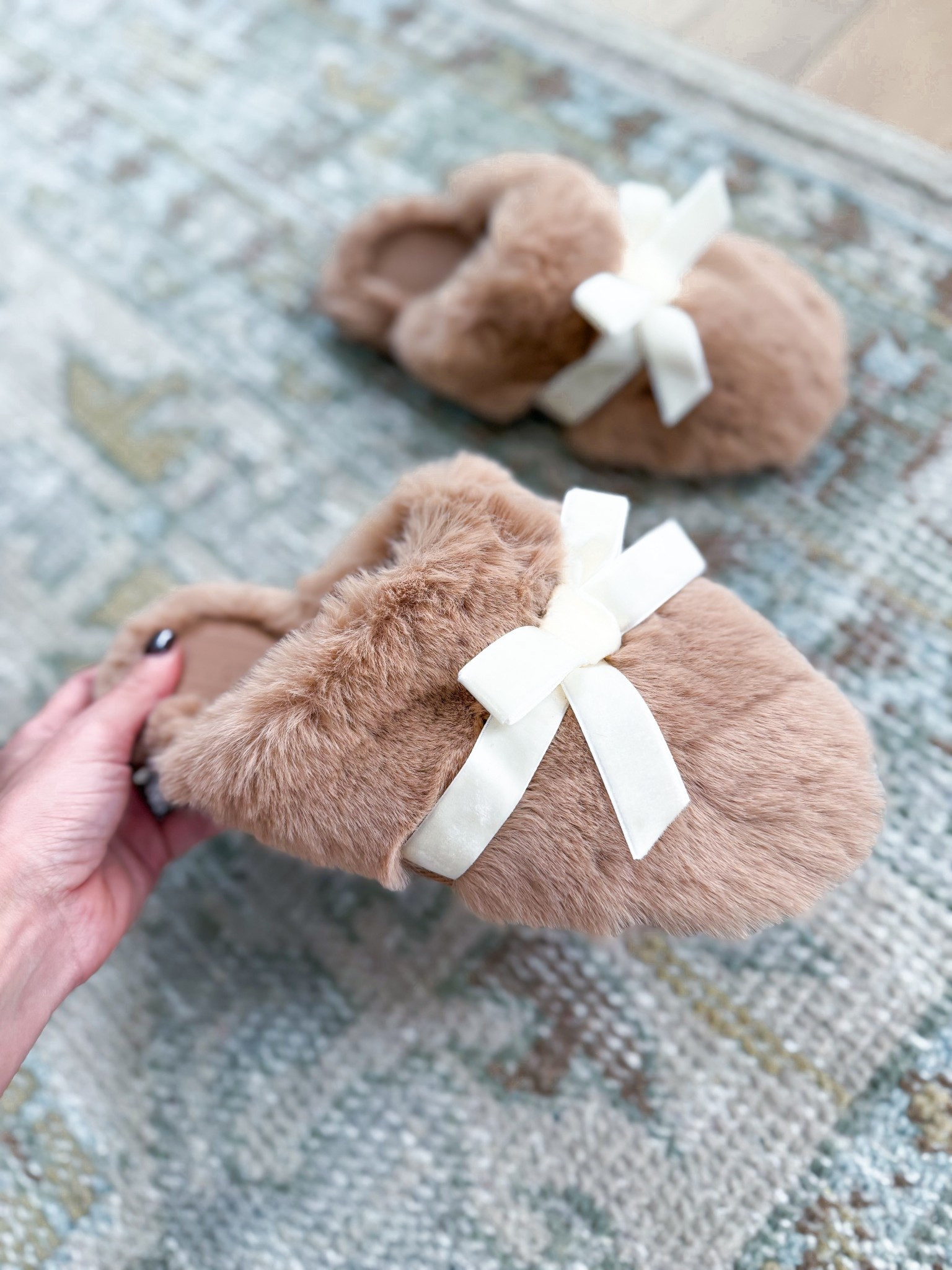 Bow slippers - this would make a great gift! So soft!! I’m a 6.5 and do medium. Lots of colors. Christmas gift idea. Bow slippers.

#LTKSeasonal #LTKHoliday #LTKFindsUnder50