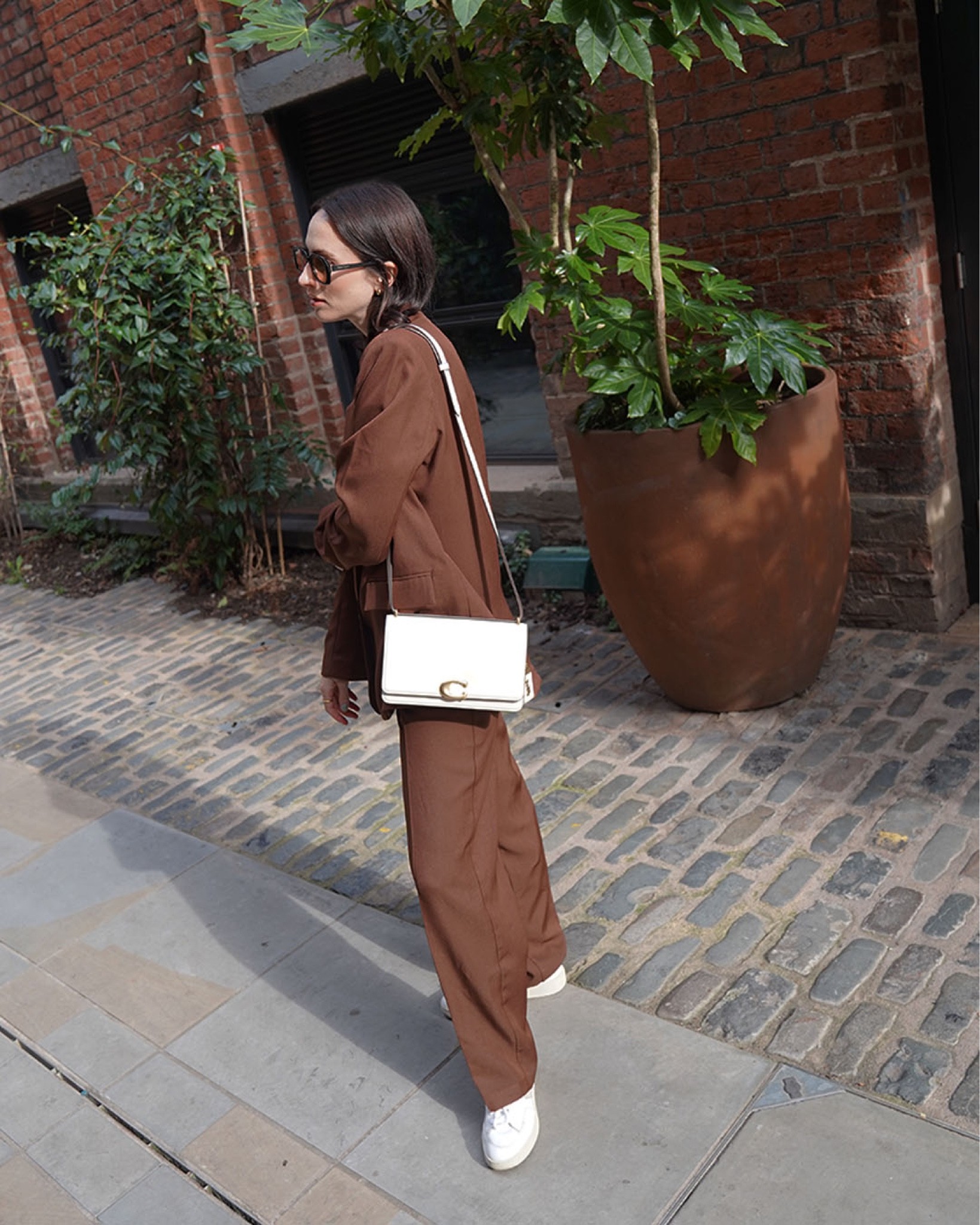 frankie shop brown suit 
line by K asymmetric white tee 
velvet canyon sunglasses 
veja trainers 
coach bandit bag 
15% off mybag online using code HANNI15 
autumn style
autumn outfit ideas 

#LTKstyletip #LTKSeasonal #LTKeurope