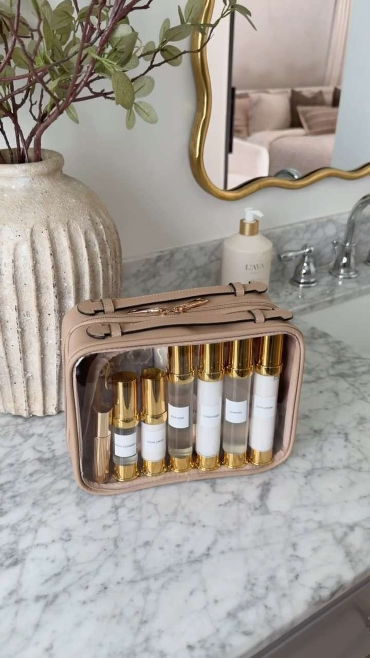 Amazon packing finds that make traveling so much easier. ✈️✨  There’s just something so satisfying about this toiletry bag and these pretty little travel sized containers. 🤎 

 #amazonfinds #packingfinds #traveleessentials #toiletrybag #makeuporganizer #vacationfinds #carryonpacking #amazontravel #beautyorganization #LTKtravel #LTKootd #LTKBeauty #LTKTravel