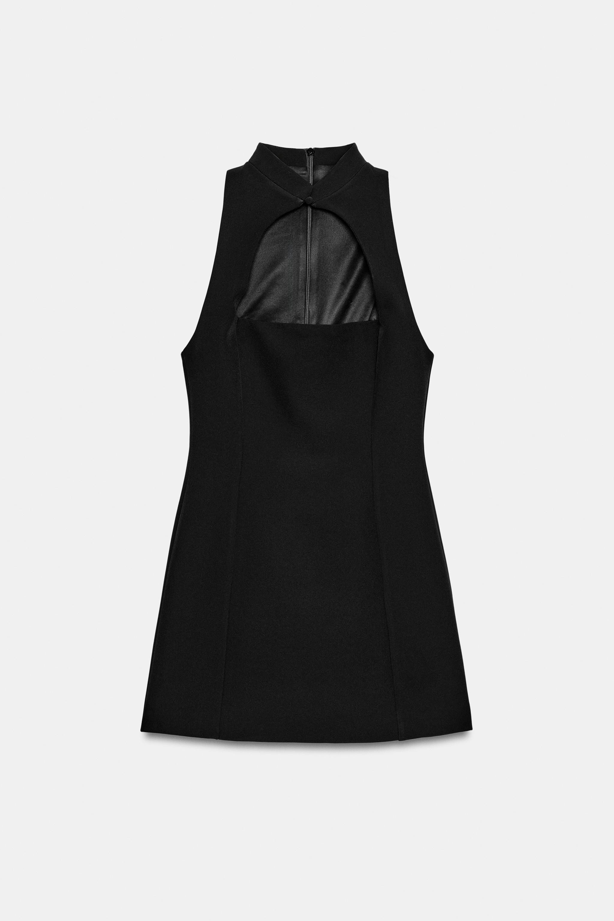 Model height: 178 cmMini dress featuring a stand collar with a button opening. Sleeveless design.... | Zara UK