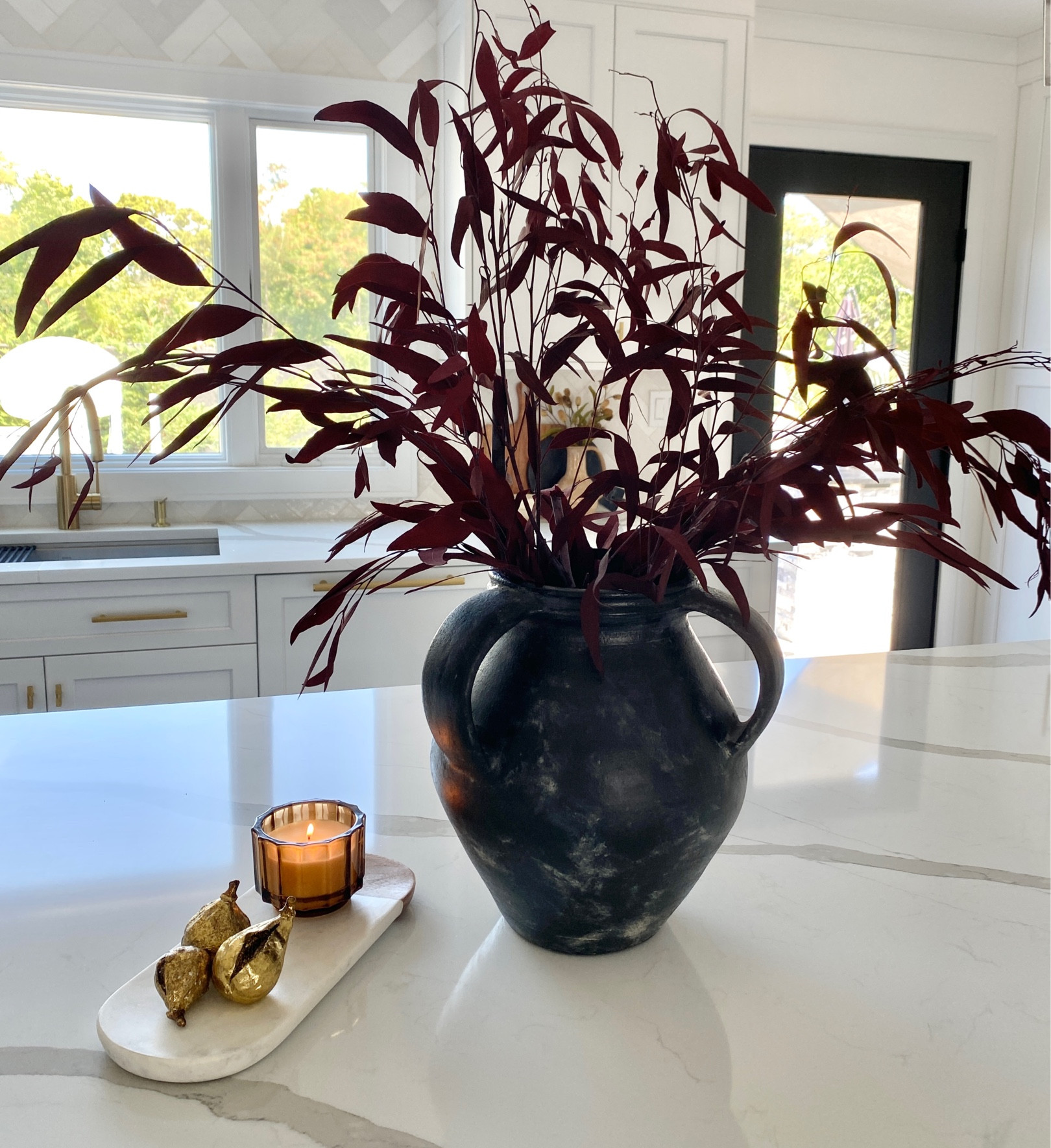 Kitchen island fall decor!

Black pottery barn vase, red dried eucalyptus stems, fall floral, brass figs, gold figs, seasonal candle, amber candle, pumpkin candle, marble tray, dried floral, fall decor, kitchen decor, modern farmhouse, modern organic decor

#LTKSeasonal #LTKhome