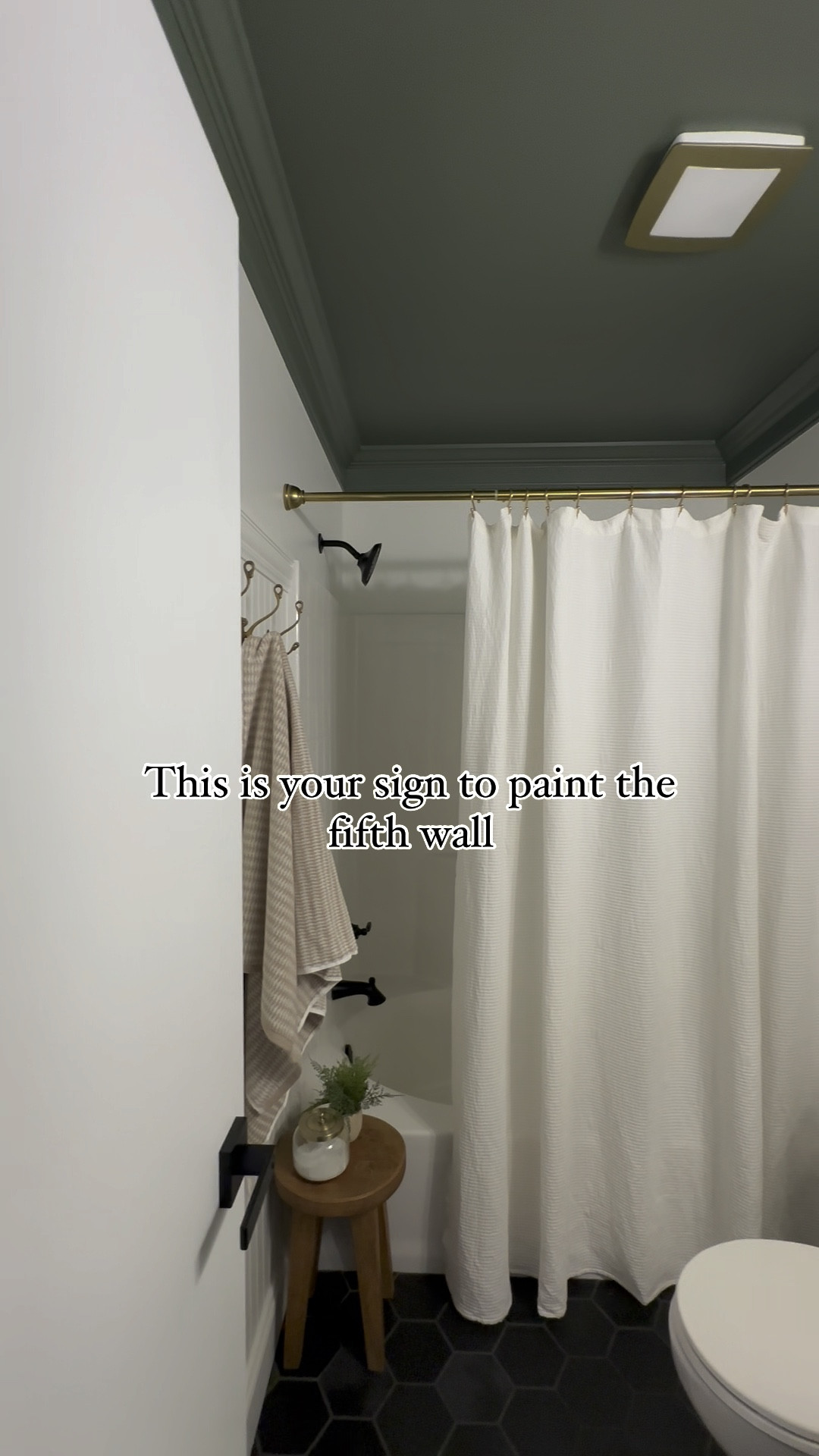 Green bathroom vanity, green ceiling, vintage art, brass cabinet pulls, Amazon finds, hearth and hand shower curtain, white shower curtain, black porcelain tile, brass bathroom fan, Surya Our PNW rug, wood bathroom stool, delta black shower faucet, brass vintage towel hooks, textured shower curtain, Turkish towel, vintage rug

#LTKStyleTip #LTKHome