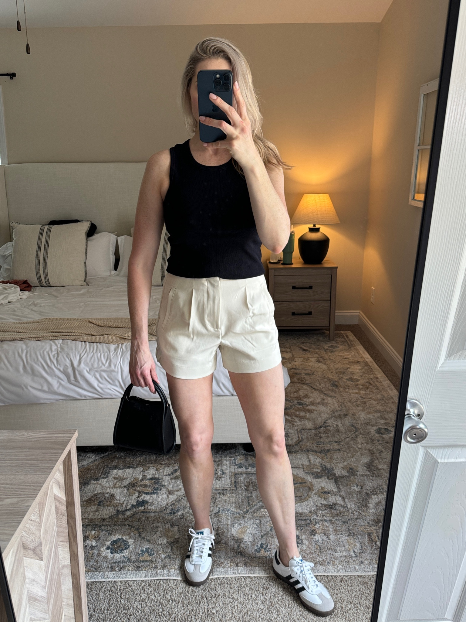 Black tank, trouser shorts, sambas and a black handbag

#LTKshoecrush #LTKfindsunder50 #LTKitbag