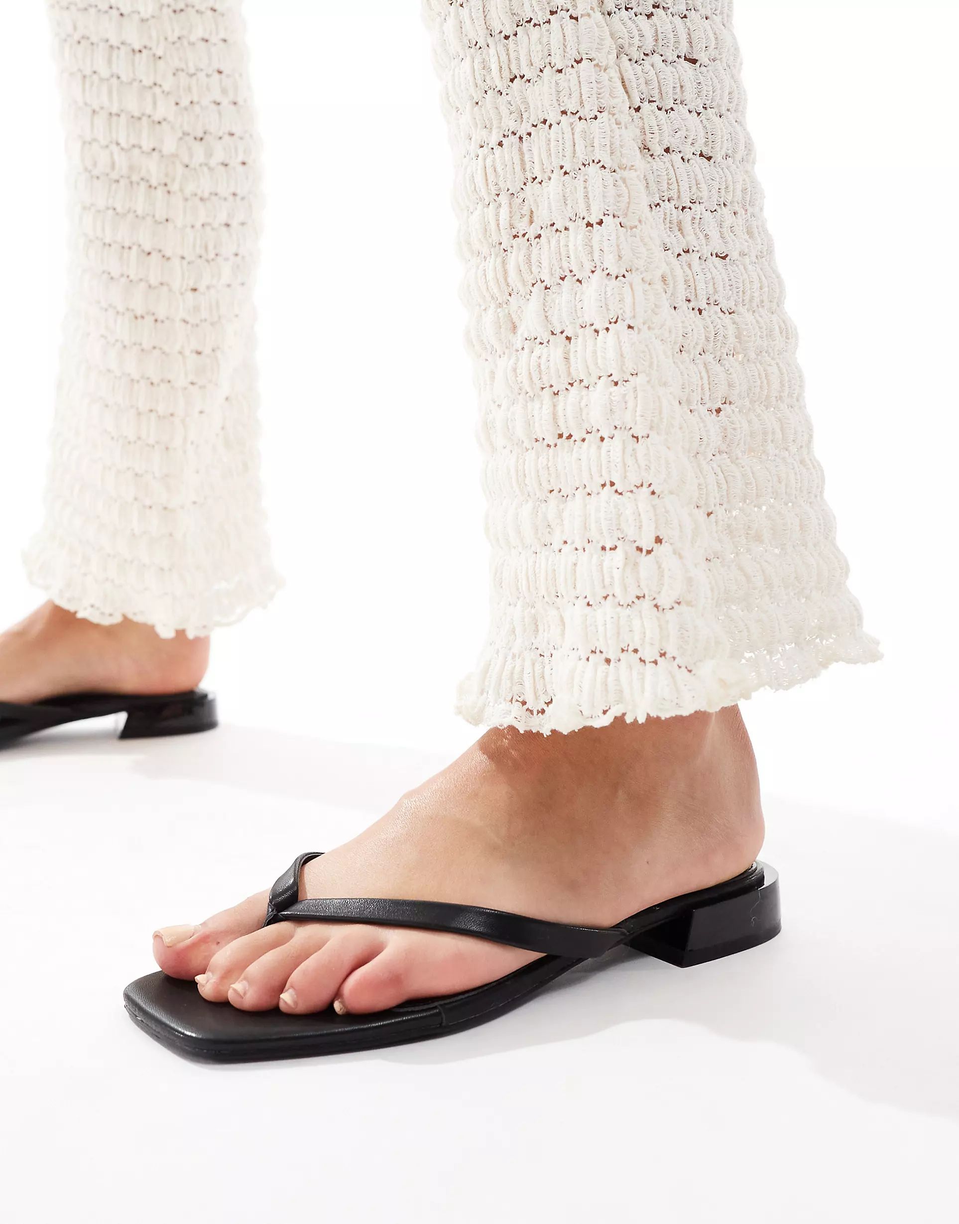 ASOS DESIGN Felicity skinny toe-thong flat sandals in black | ASOS (Global)